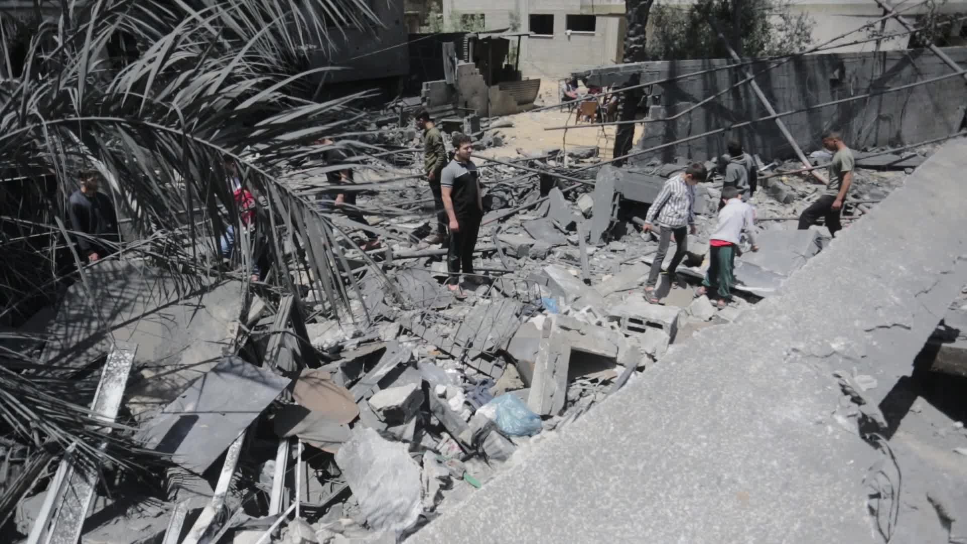 Palestinians inspect damage following Israeli air strikes