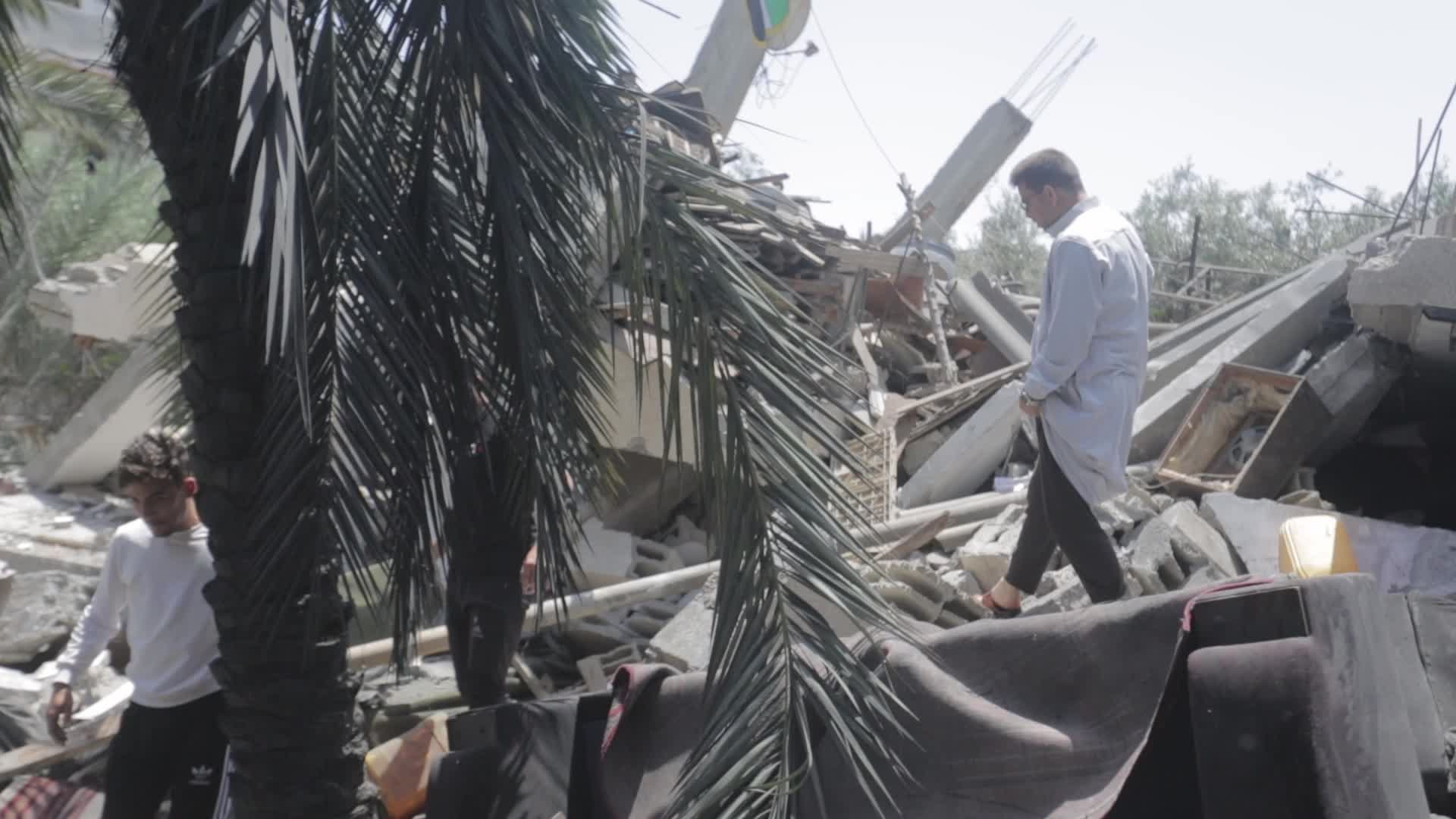 Palestinians inspect damage following Israeli air strikes