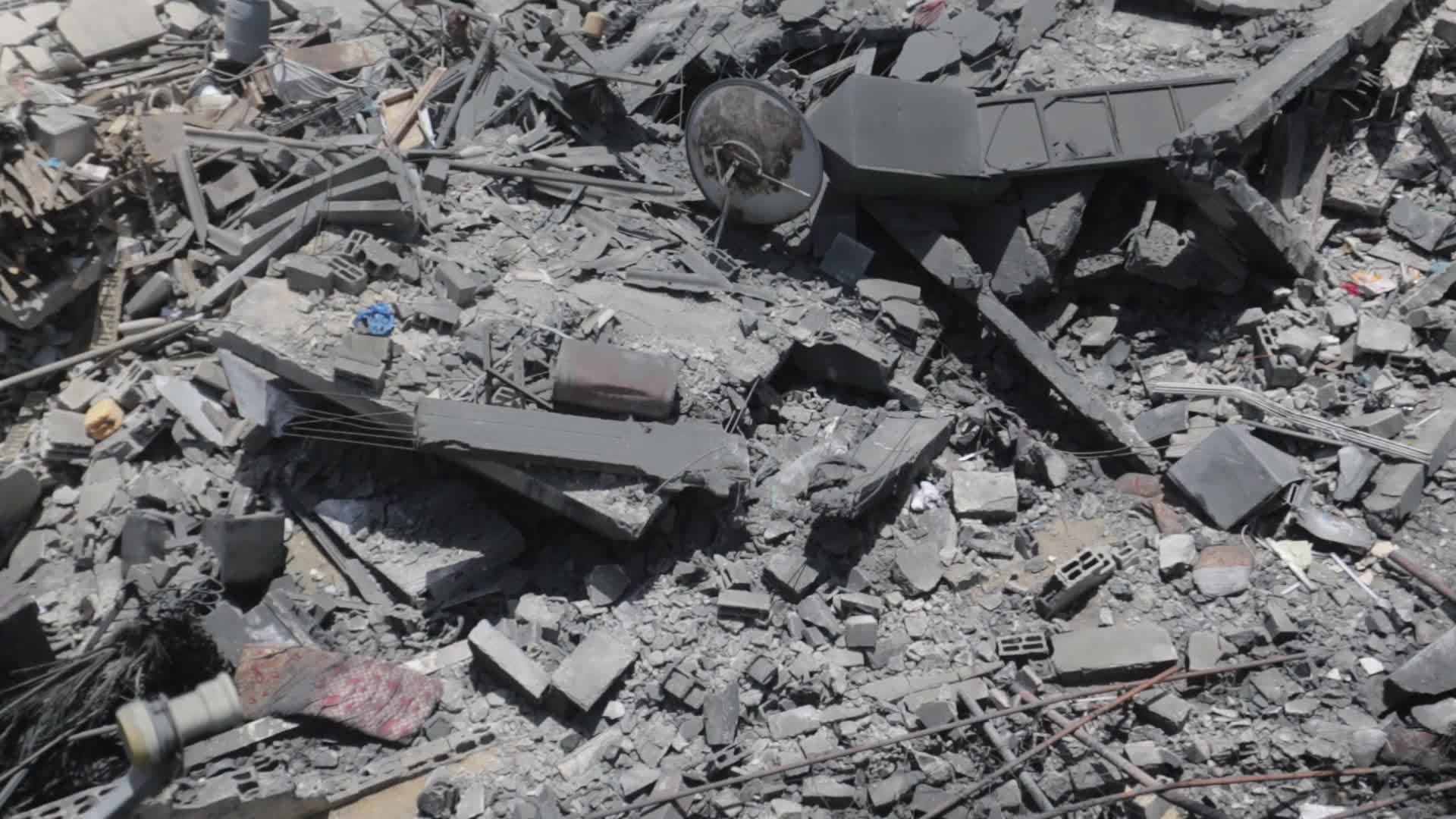 Palestinians inspect damage following Israeli air strikes