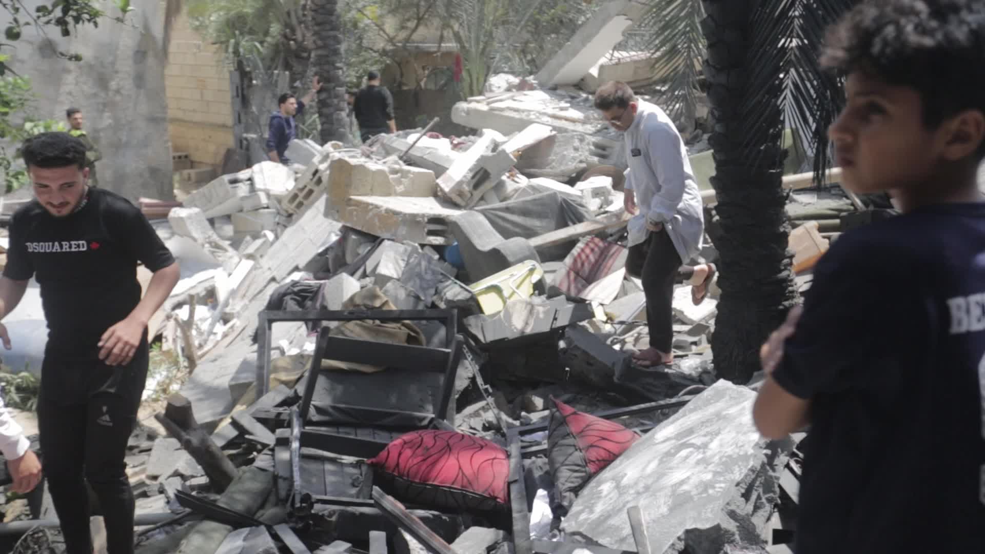Palestinians inspect damage following Israeli air strikes