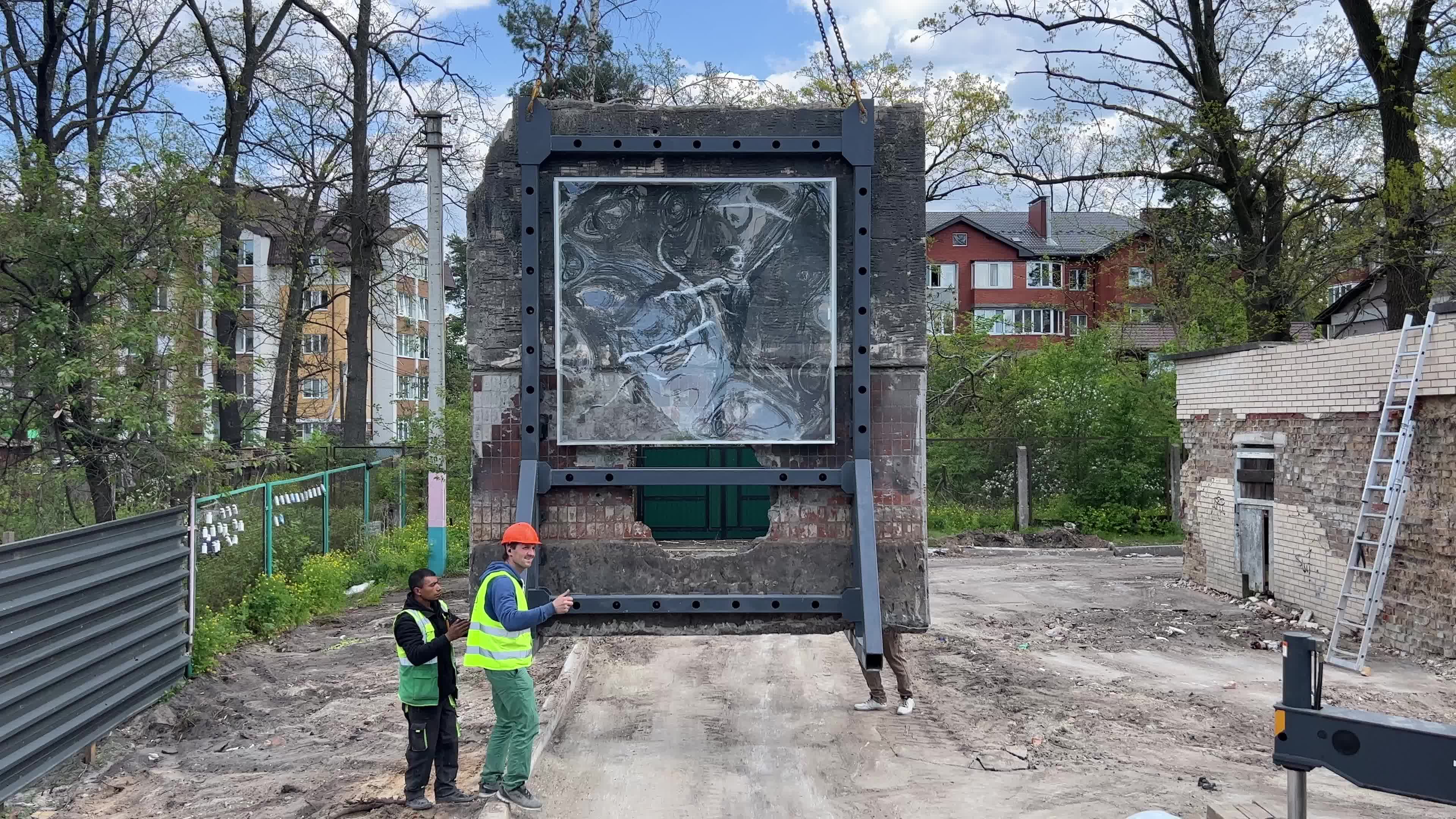 Part of a wall featuring the work of world-renowned graffiti artist Banksy is moved to a new location 