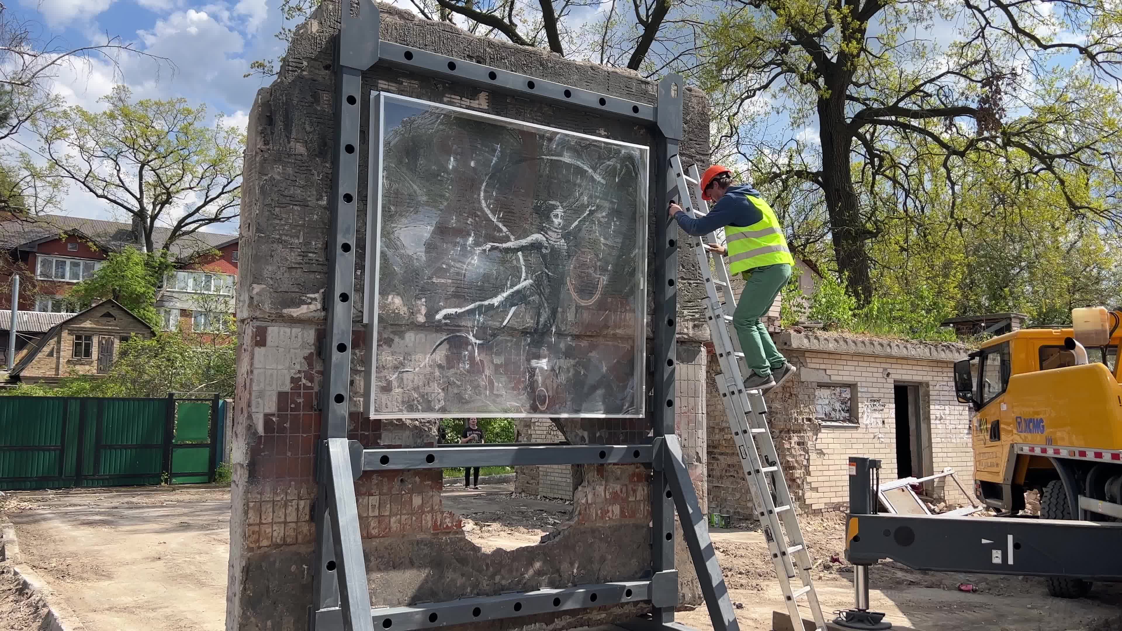 Part of a wall featuring the work of world-renowned graffiti artist Banksy is moved to a new location 