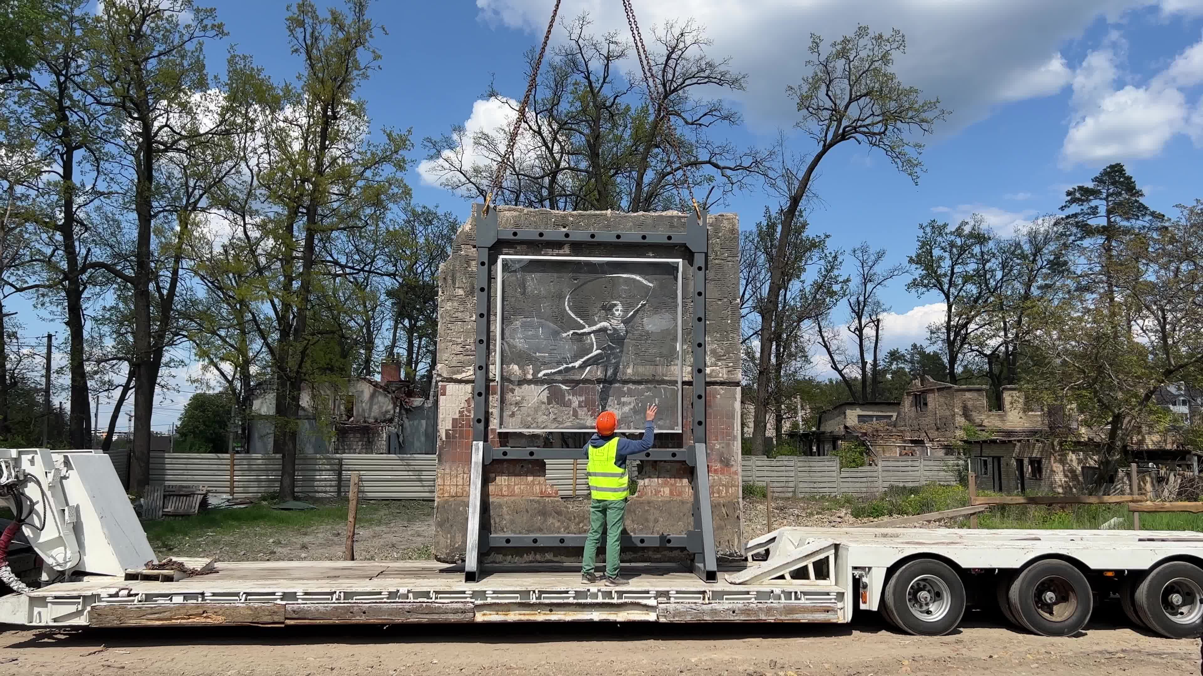 Part of a wall featuring the work of world-renowned graffiti artist Banksy is moved to a new location 