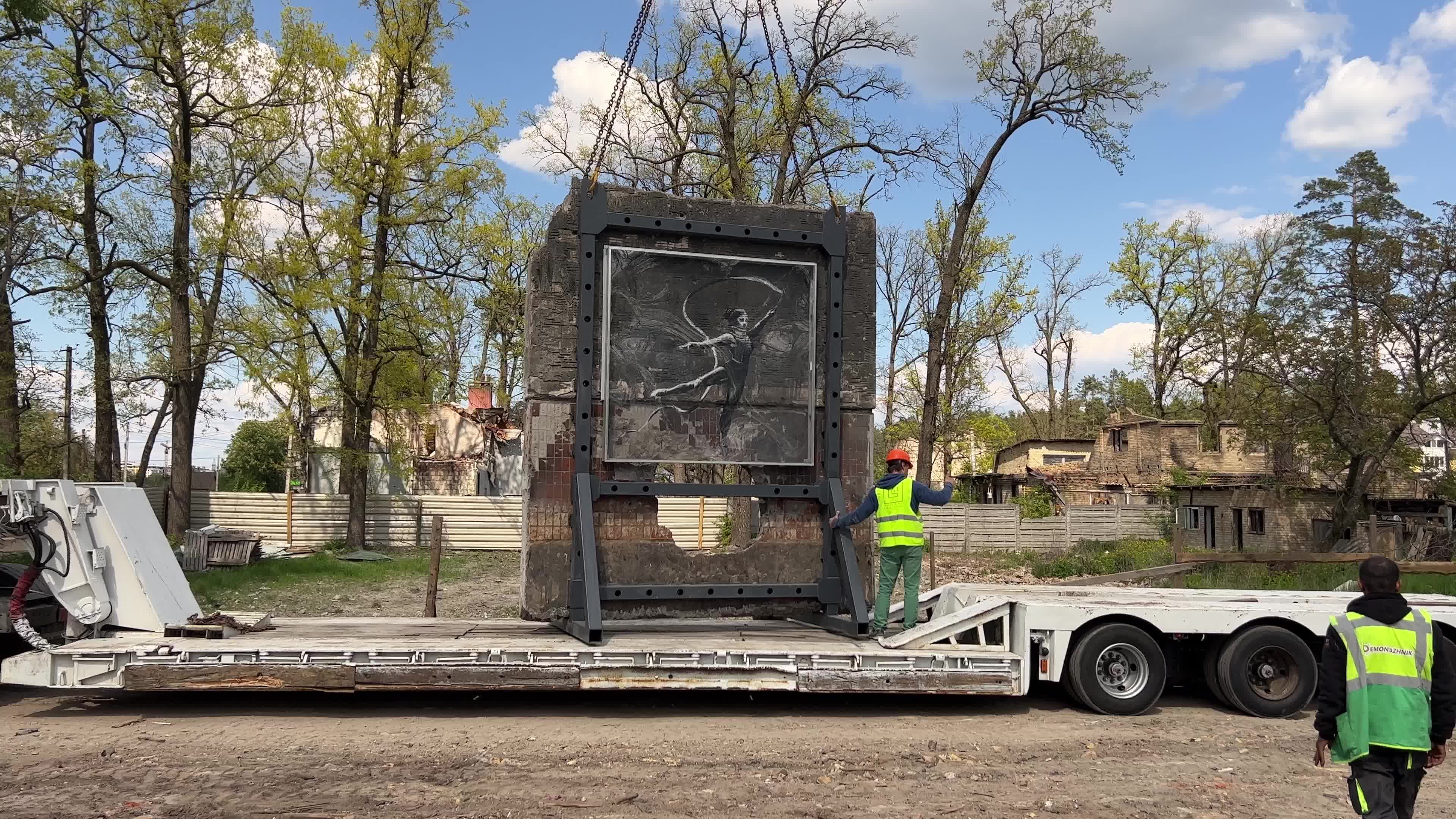 Part of a wall featuring the work of world-renowned graffiti artist Banksy is moved to a new location 