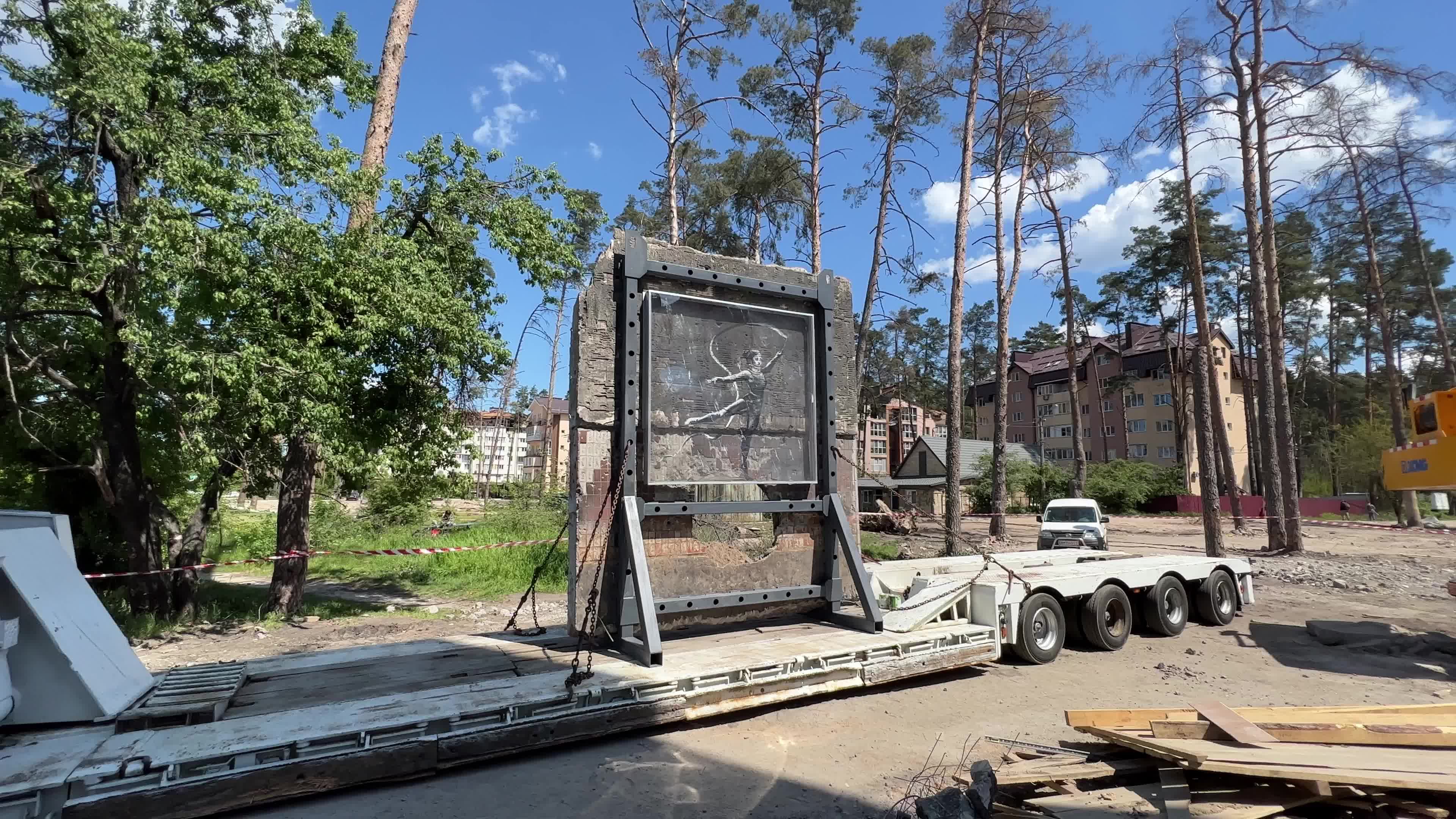 Part of a wall featuring the work of world-renowned graffiti artist Banksy is moved to a new location 
