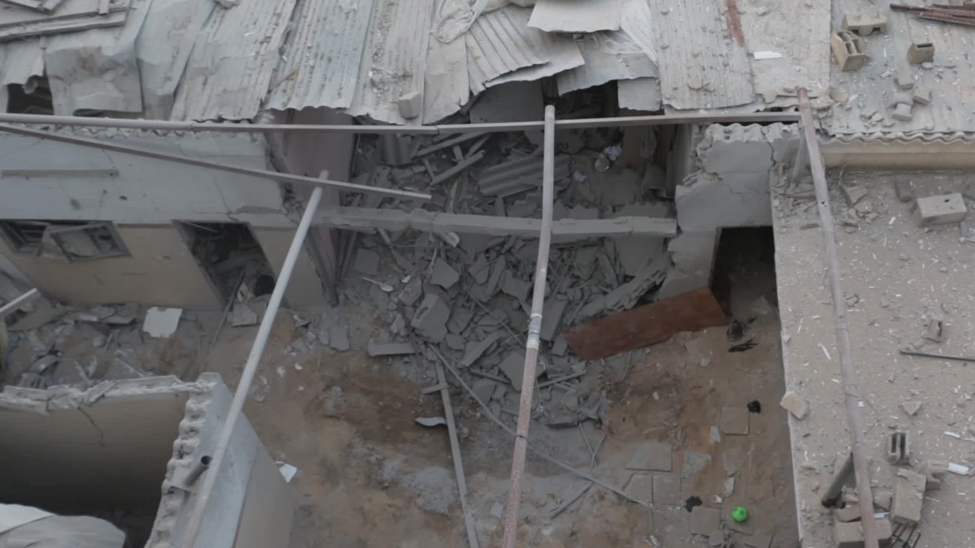 Palestinians inspect damage following Israeli air strikes in Gaza
