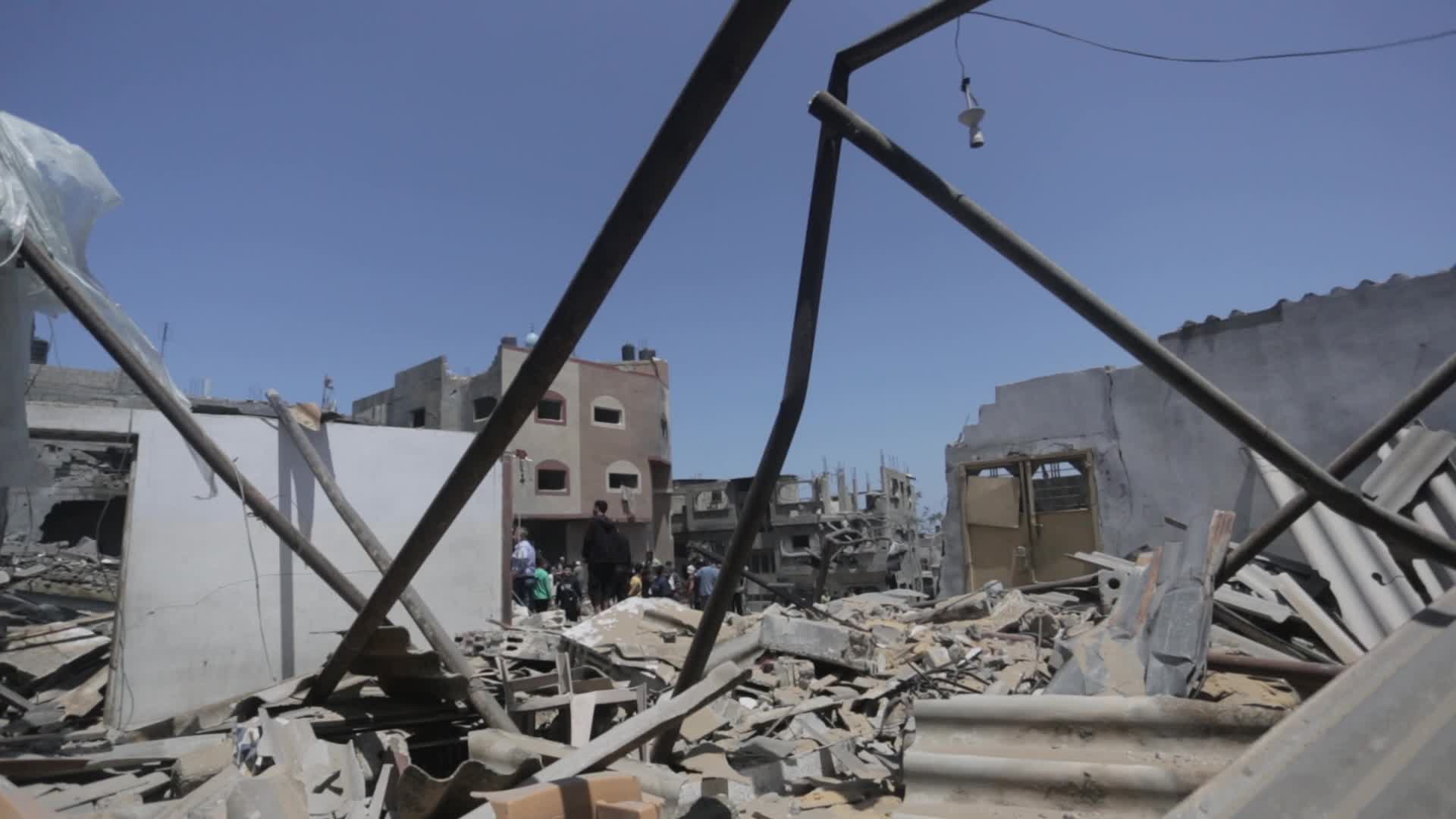 Palestinians inspect damage following Israeli air strikes in Gaza