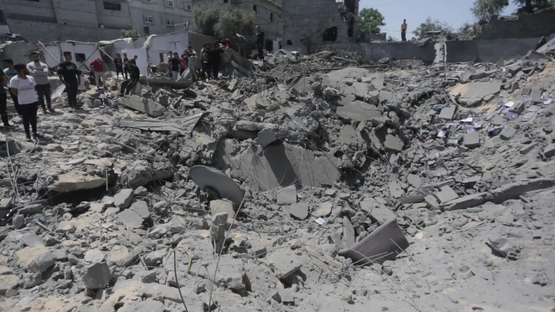 Palestinians inspect damage following Israeli air strikes in Gaza