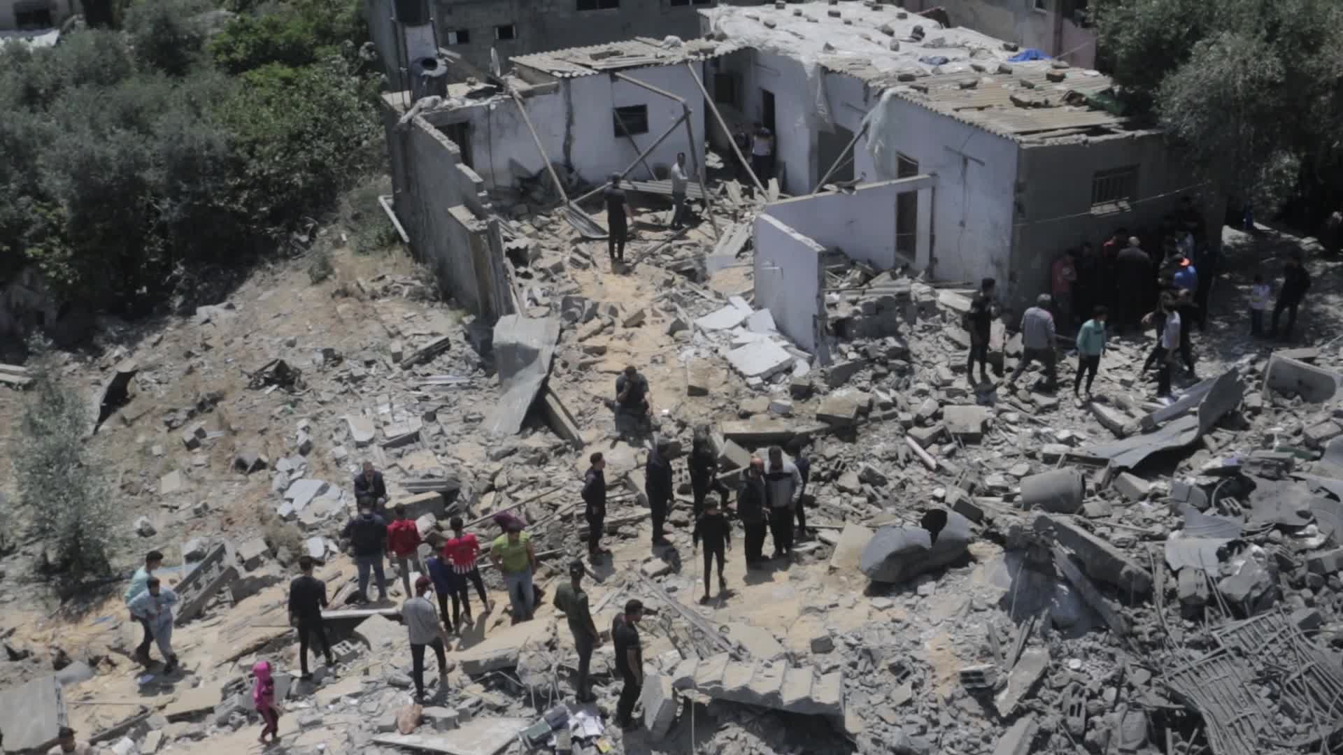 Palestinians inspect damage following Israeli air strikes in Gaza
