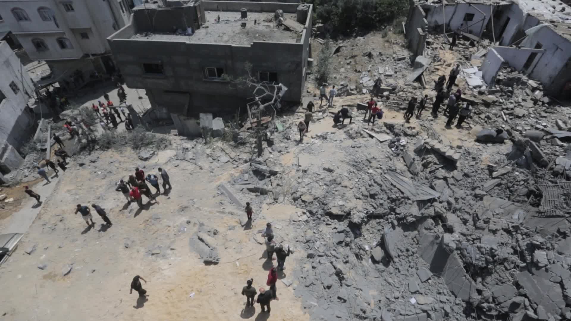 Palestinians inspect damage following Israeli air strikes in Gaza 