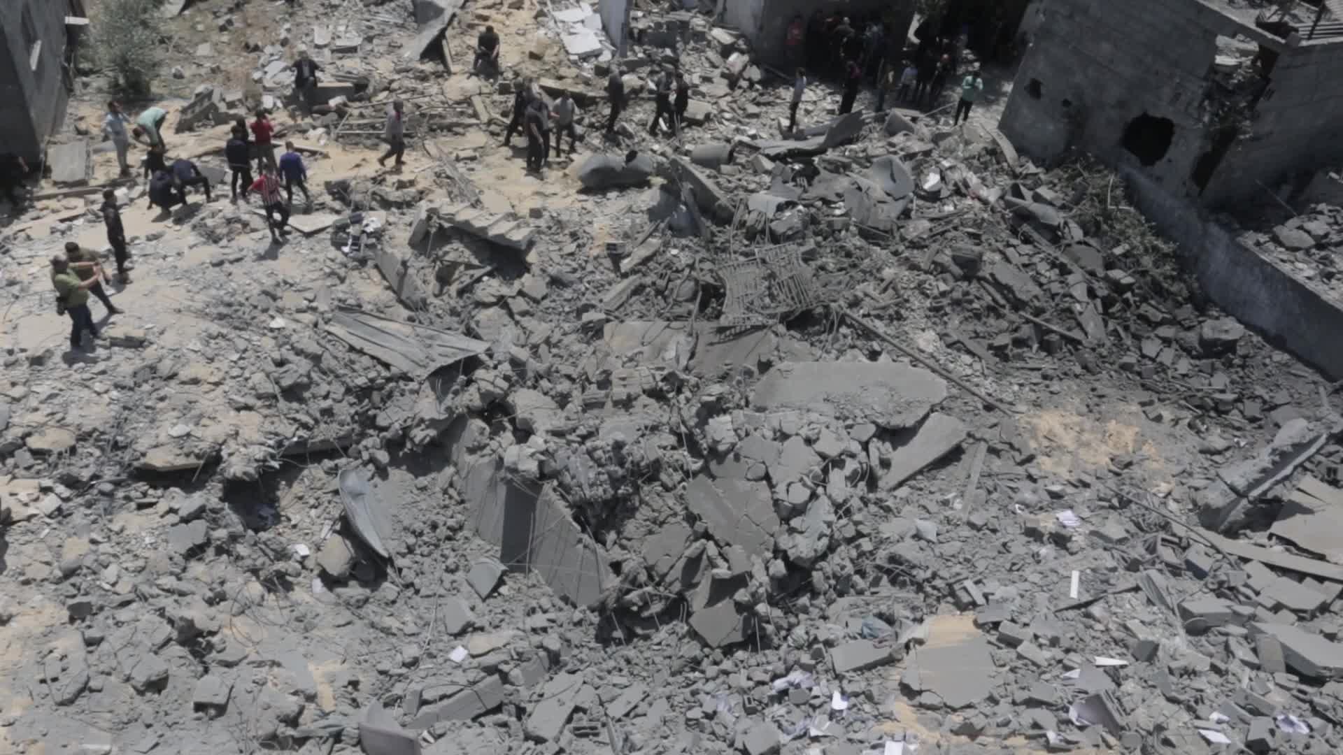 Palestinians inspect damage following Israeli air strikes in Gaza 