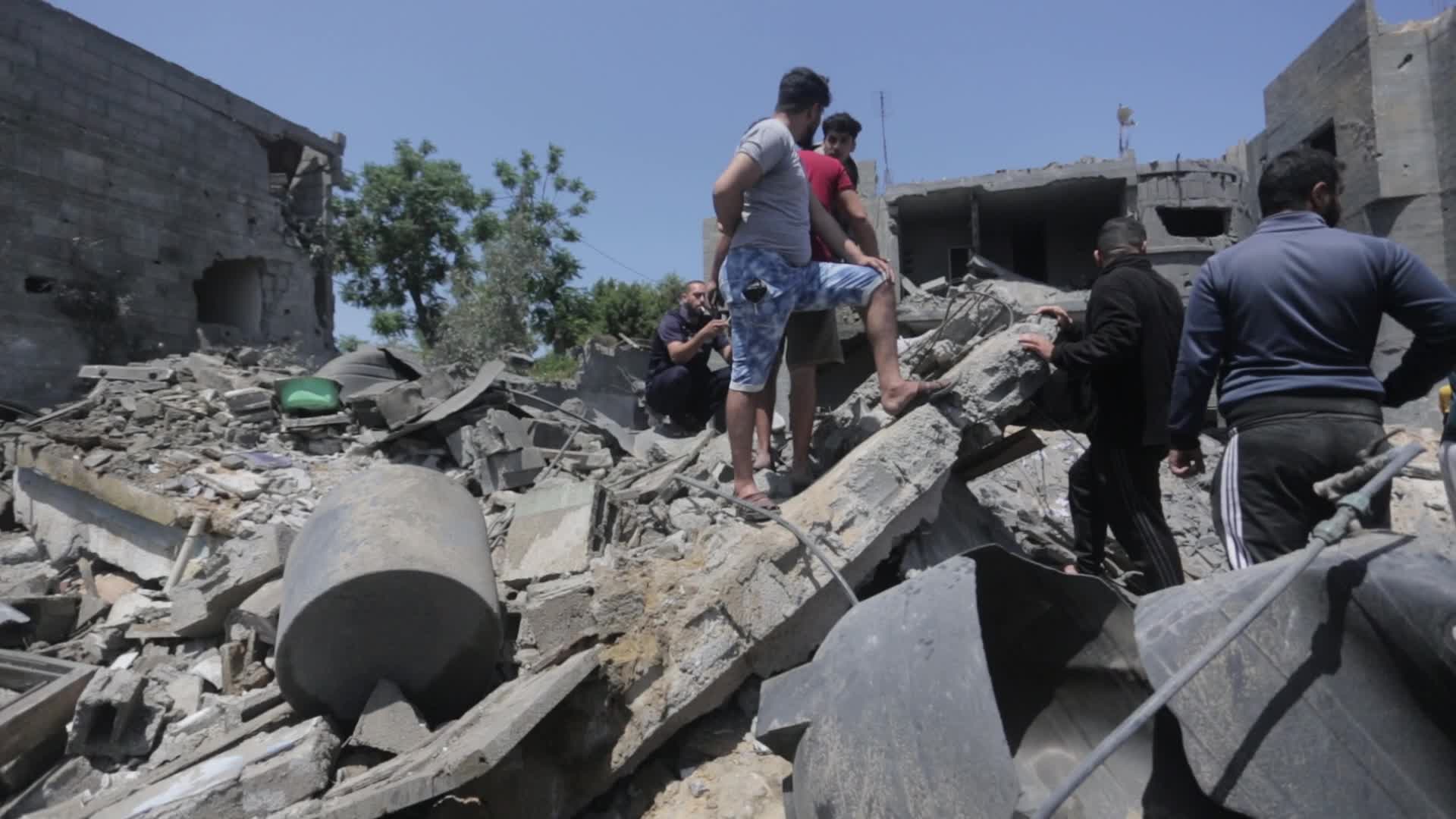 Palestinians inspect damage following Israeli air strikes in Gaza 