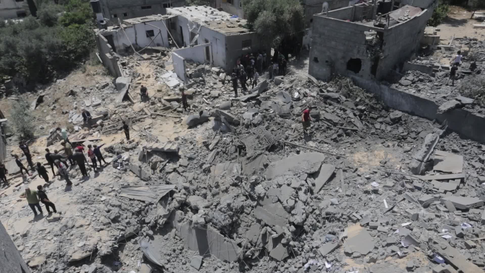Palestinians inspect damage following Israeli air strikes in Gaza 