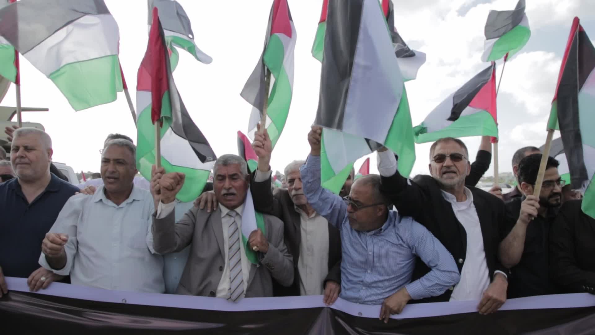 Palestinians hold a counter 'Flag March' against Israeli march 