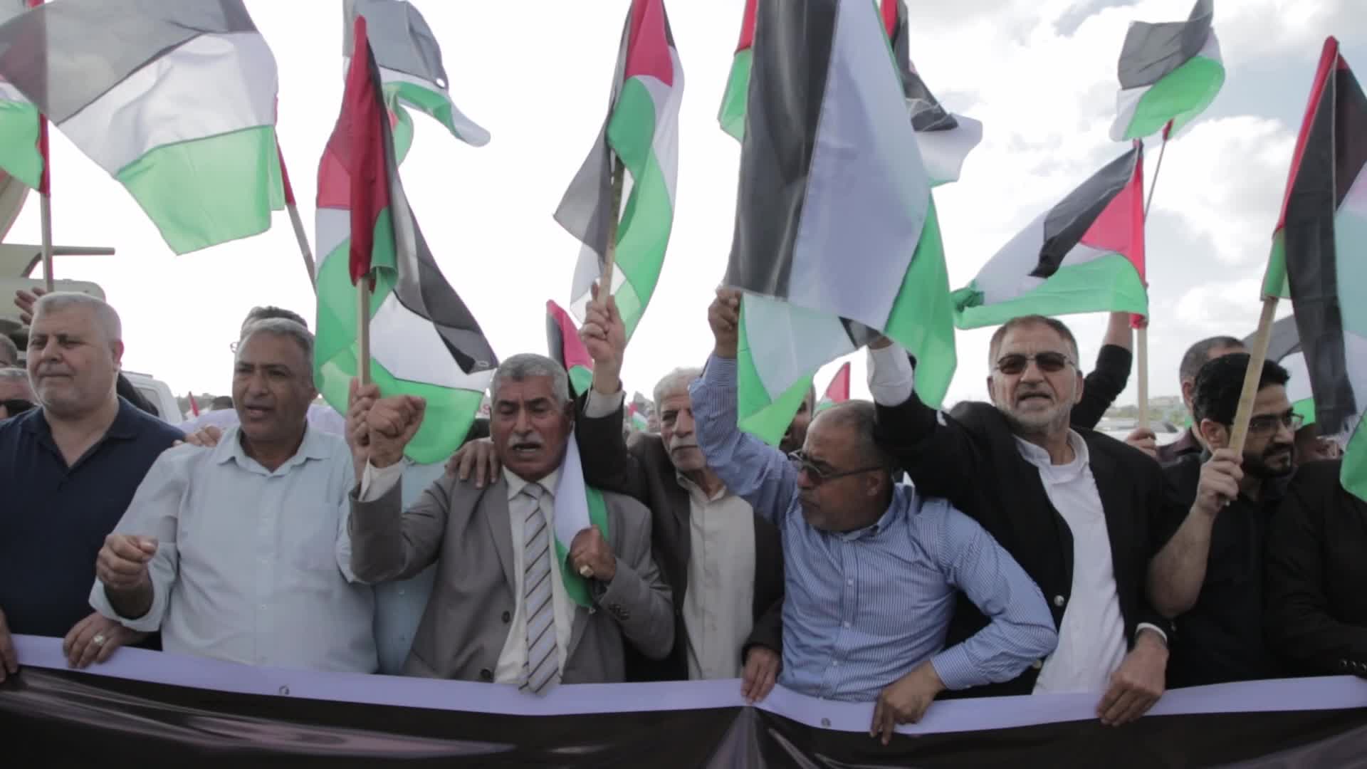 Palestinians hold a counter 'Flag March' against Israeli march 