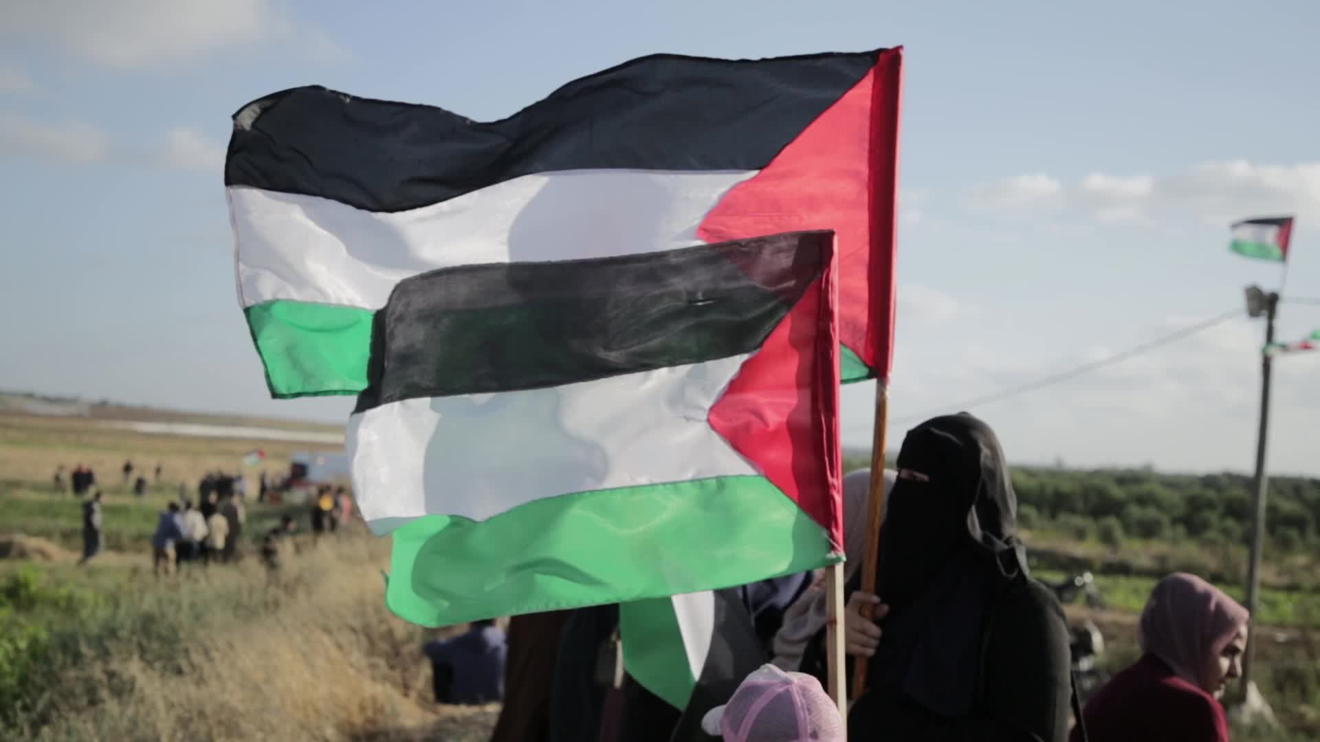 Palestinians hold a counter 'Flag March' against Israeli march 