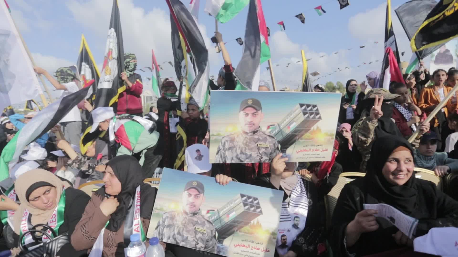 Supporters of Islamic Jihad in Gaza City, raising flags and pictures in memory of the group's leaders and activists who were killed by Israel in the recent conflict