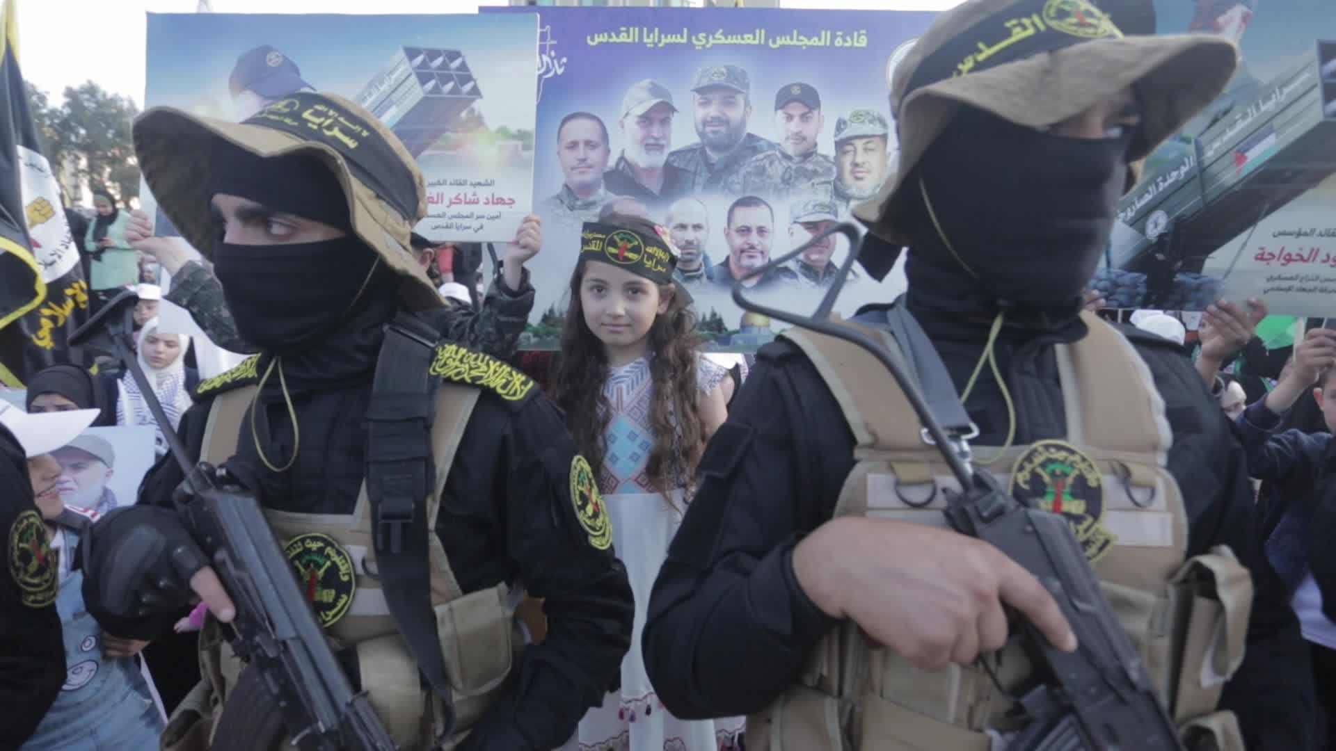 Supporters of Islamic Jihad in Gaza City, raising flags and pictures in memory of the group's leaders and activists who were killed by Israel in the recent conflict