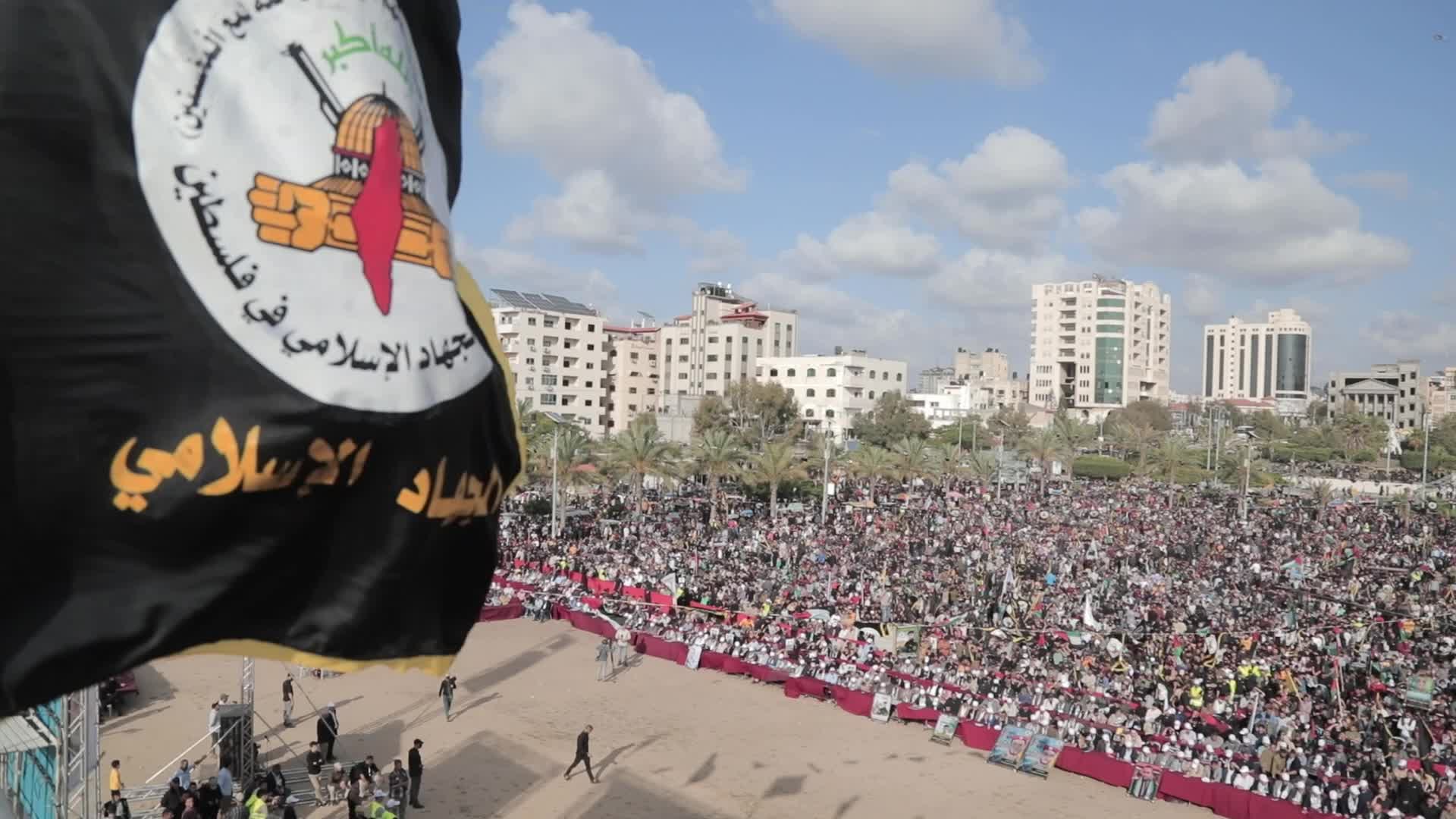 Supporters of Islamic Jihad in Gaza City, raising flags and pictures in memory of the group's leaders and activists who were killed by Israel in the recent conflict