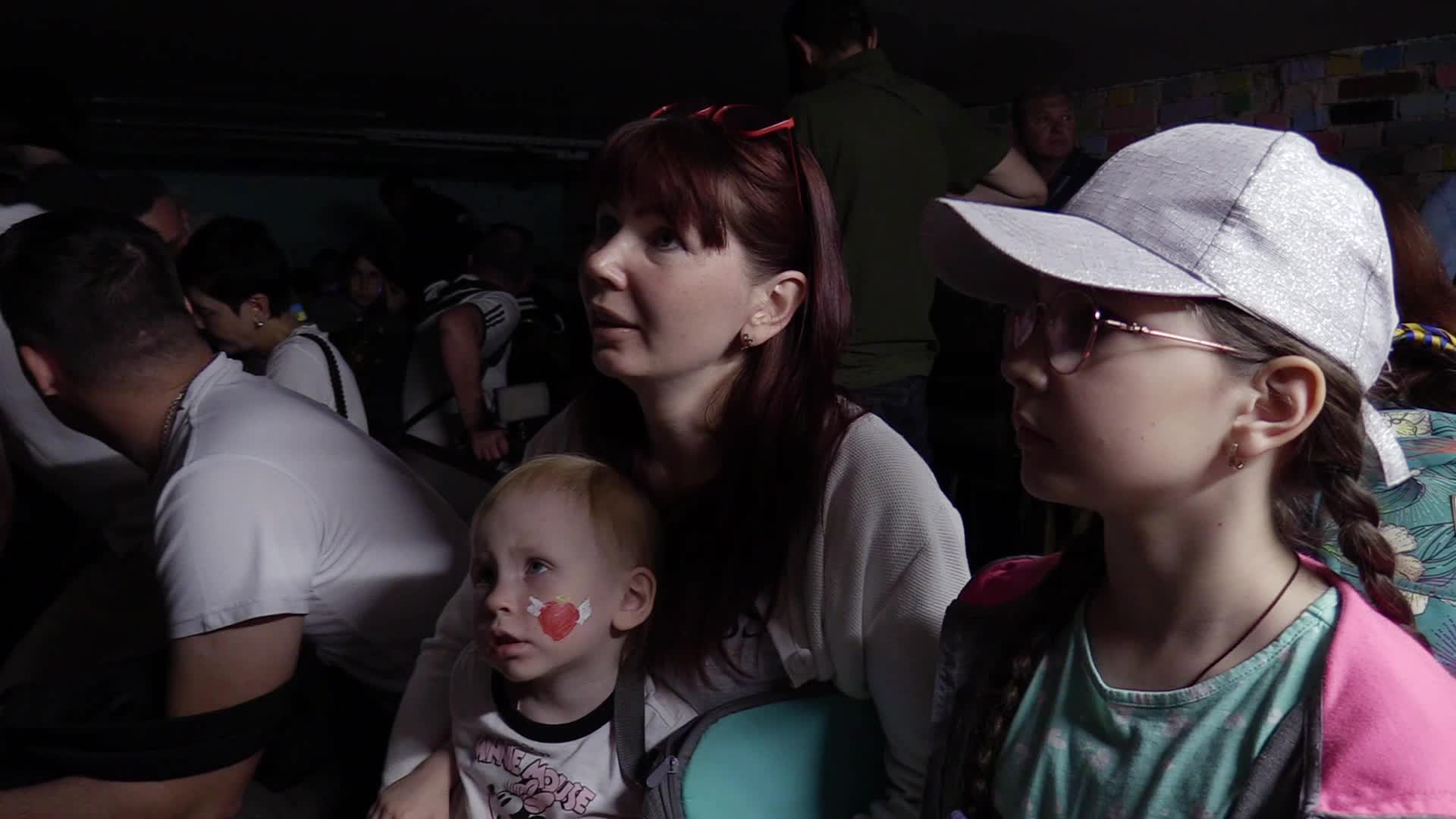 Locals take shelter in a bomb shelter during an air raid alert in Kyiv, amid Russia's invasion of Ukraine