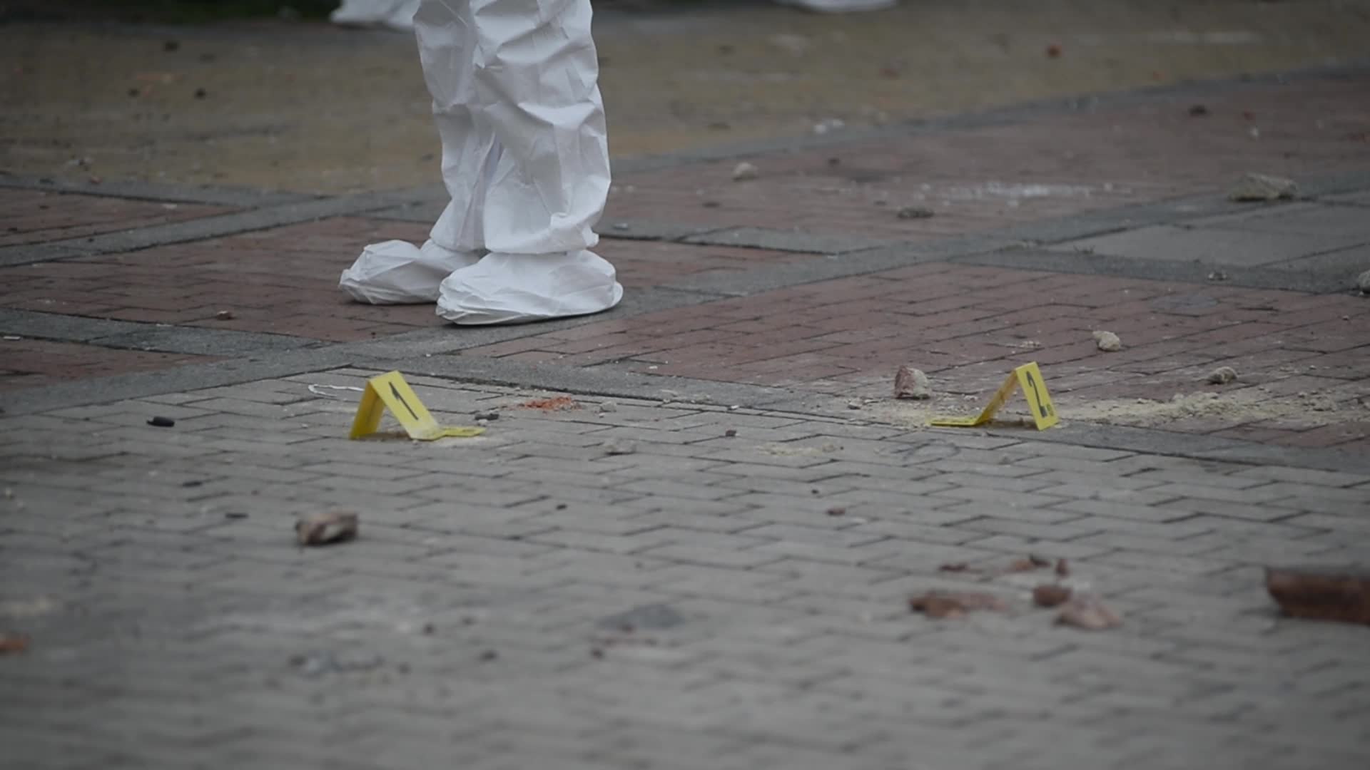 Forensic Police Recover Evidence After Two Police Officers Hit by Explosive During Clashes