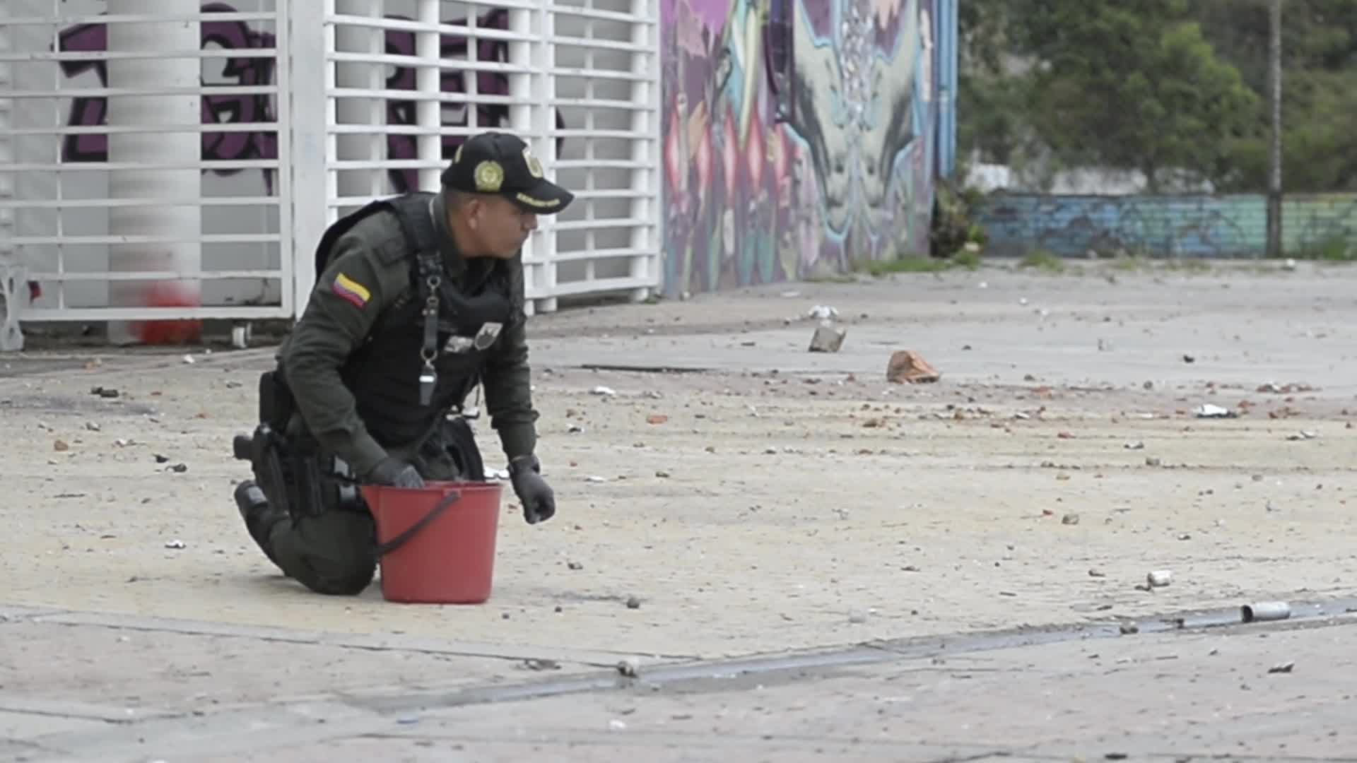 Forensic Police Recover Evidence After Two Police Officers Hit by Explosive During Clashes