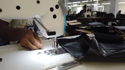 Bangladeshi workers make jute bags