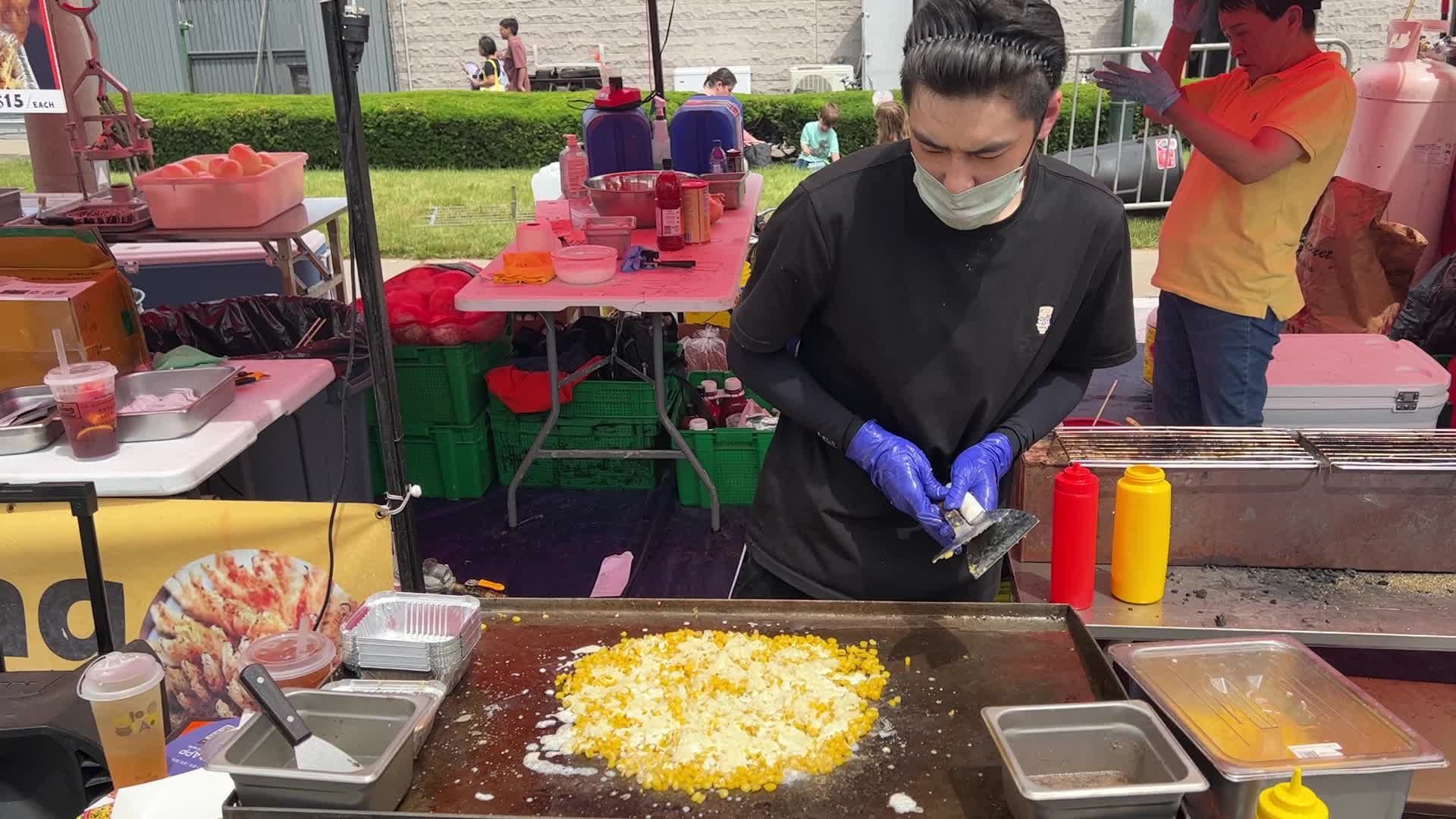 Man prepares a snack consisting of corn kernels with melted cheese