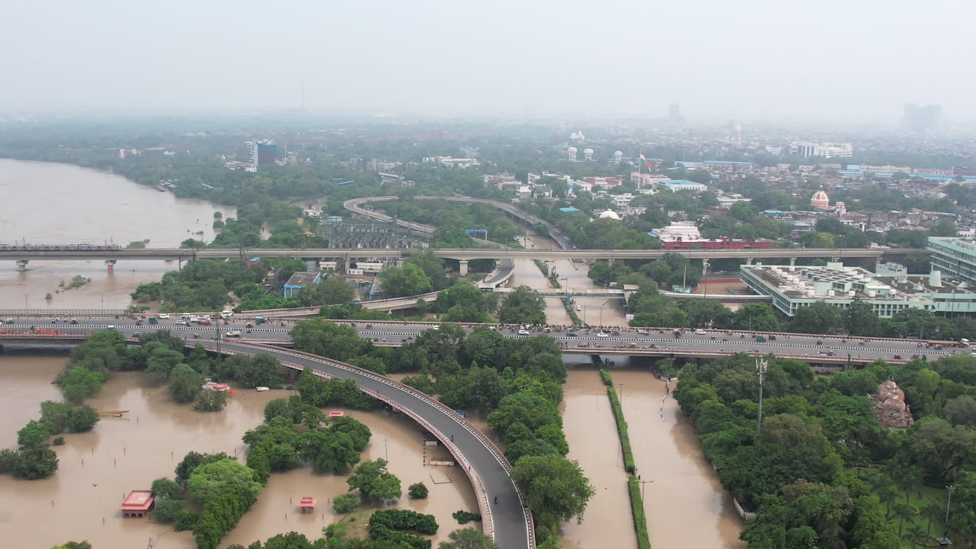 Drone view of flooded streets in New Delhi near Yamuna River.