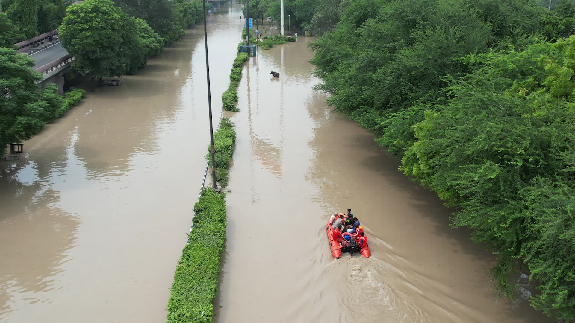 Drone view of flooded streets in New Delhi near Yamuna River.