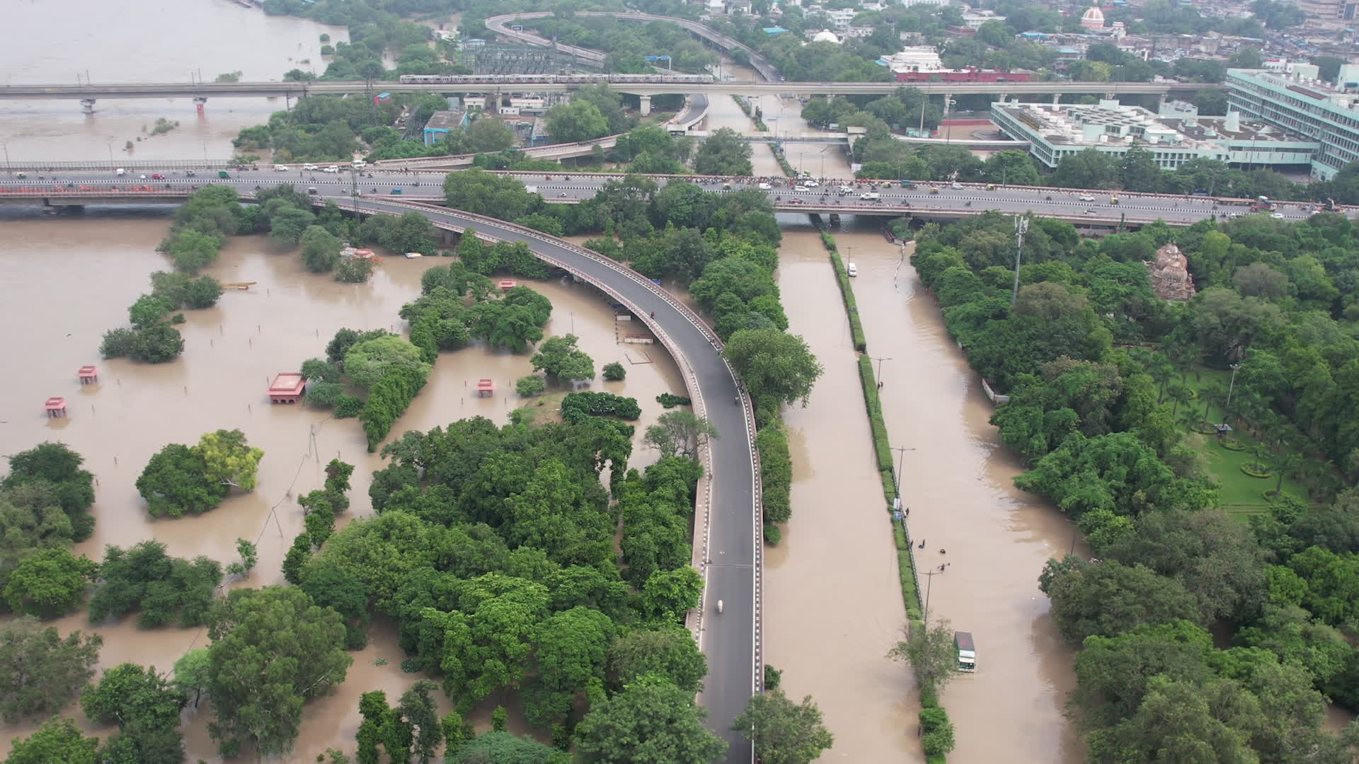 Drone view of flooded streets in New Delhi near Yamuna River.