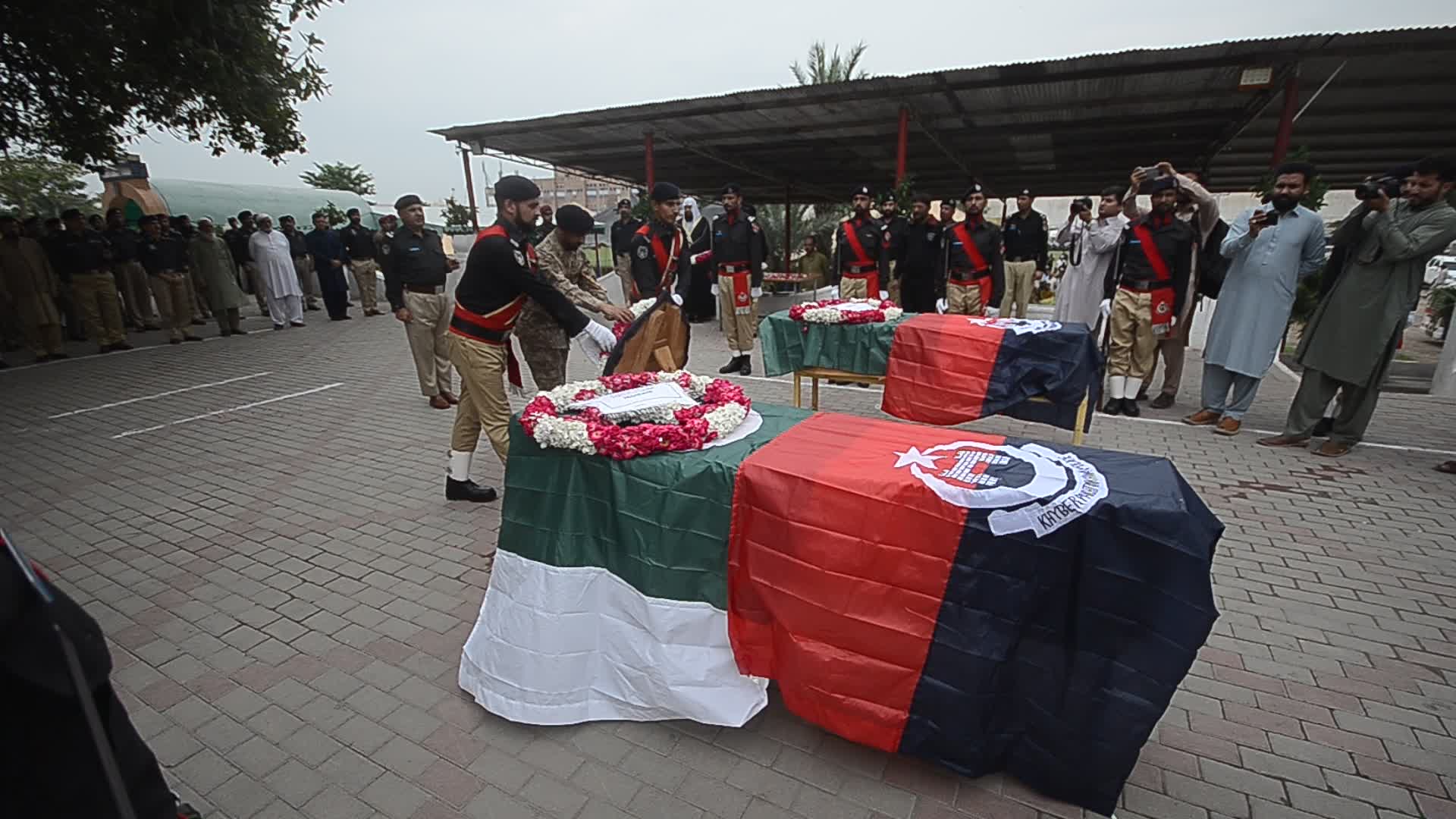 Funeral of two police personnel killed in gun attack at a checkpoint in Peshawar
