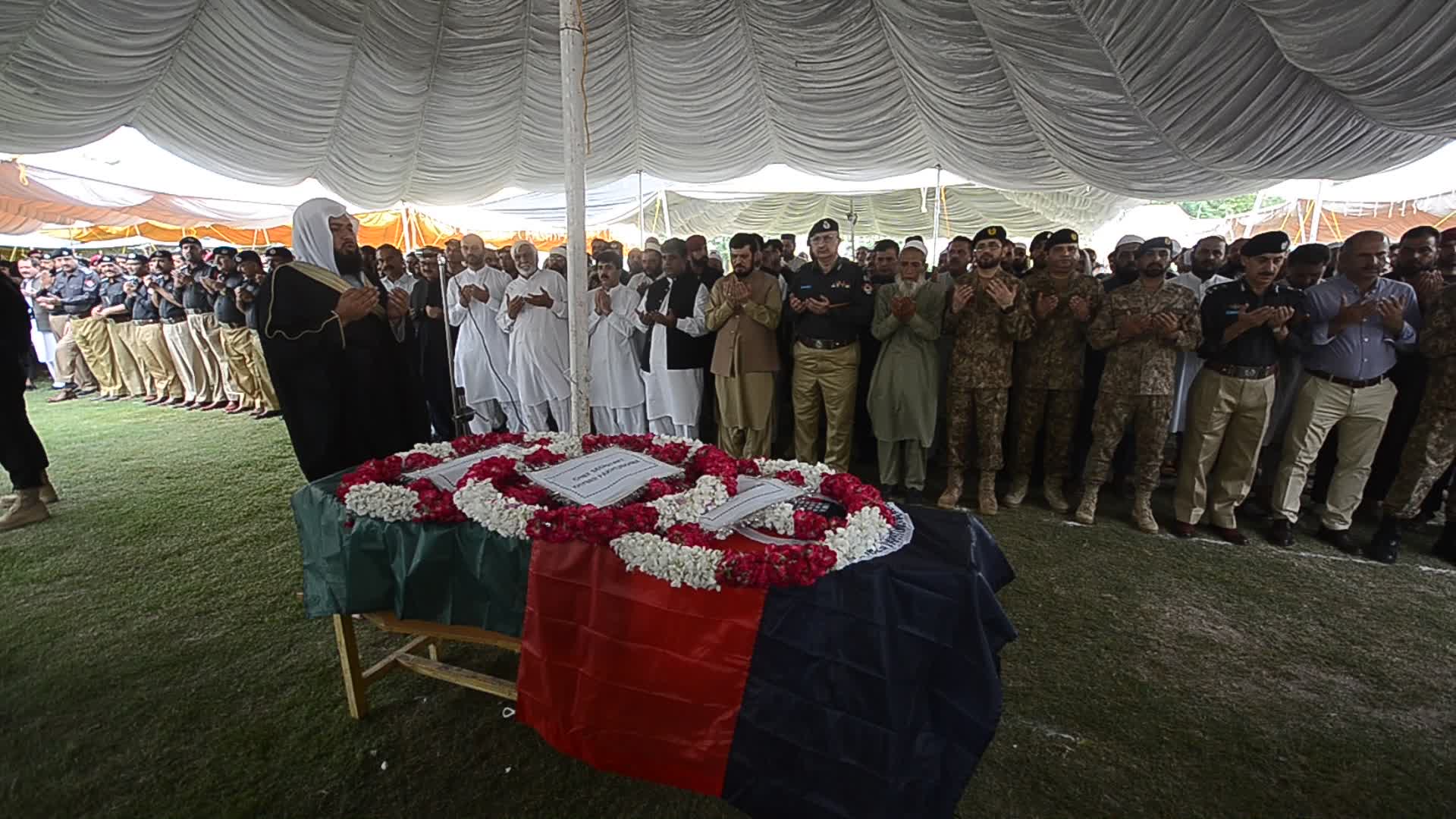 Funeral of two police personnel killed in gun attack at a checkpoint in Peshawar
