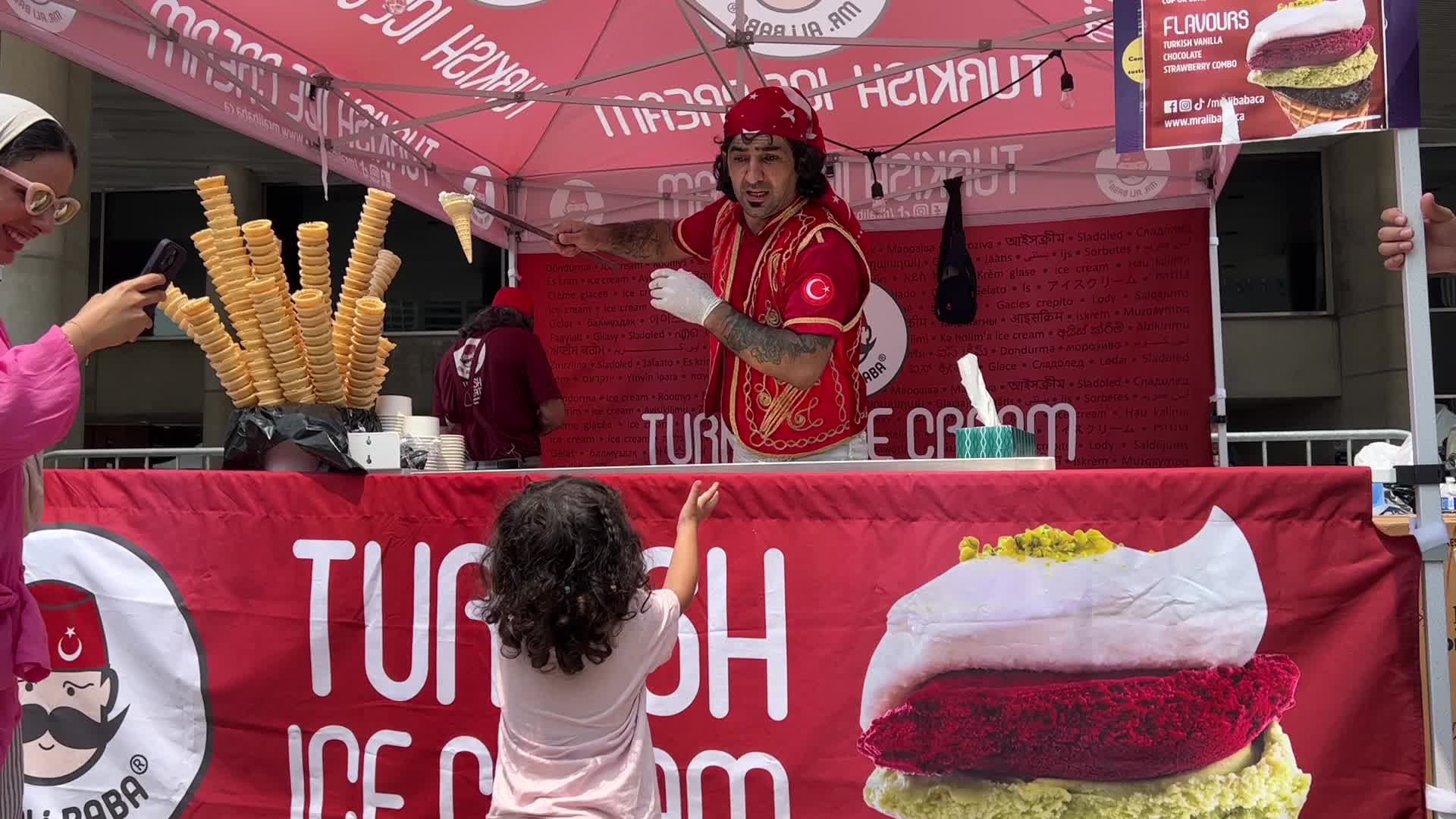 Turkish ice cream vendor performs tricks