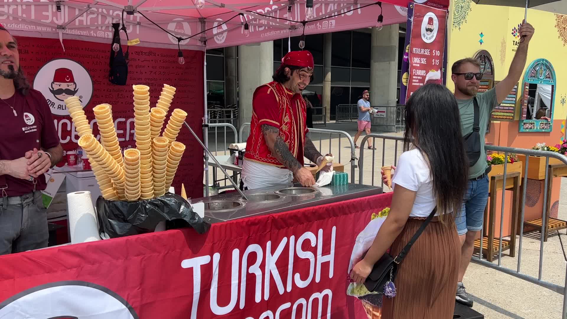 Turkish ice cream vendor performs tricks
