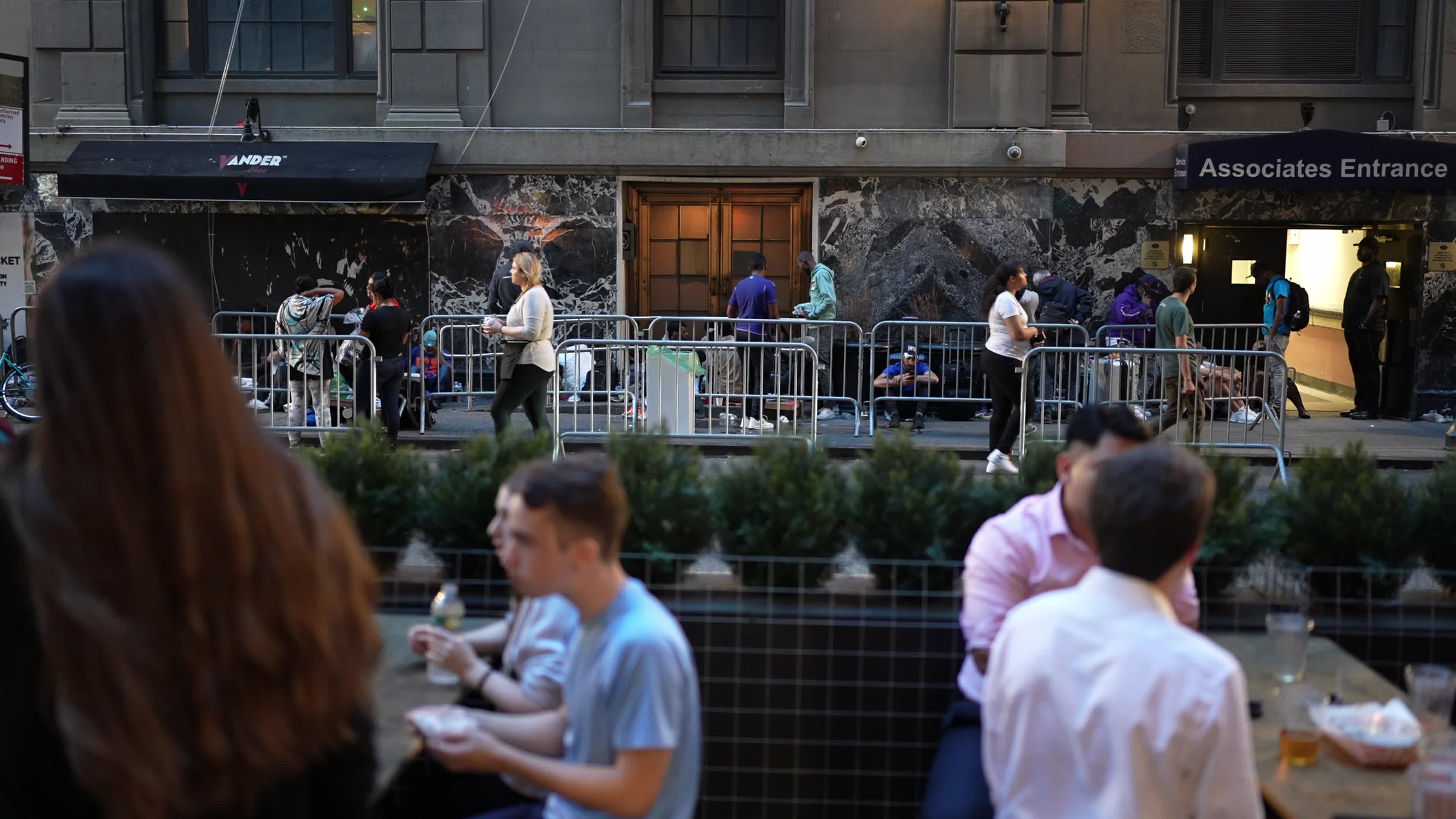 Asylum Seekers Line Up and Wait for Housing