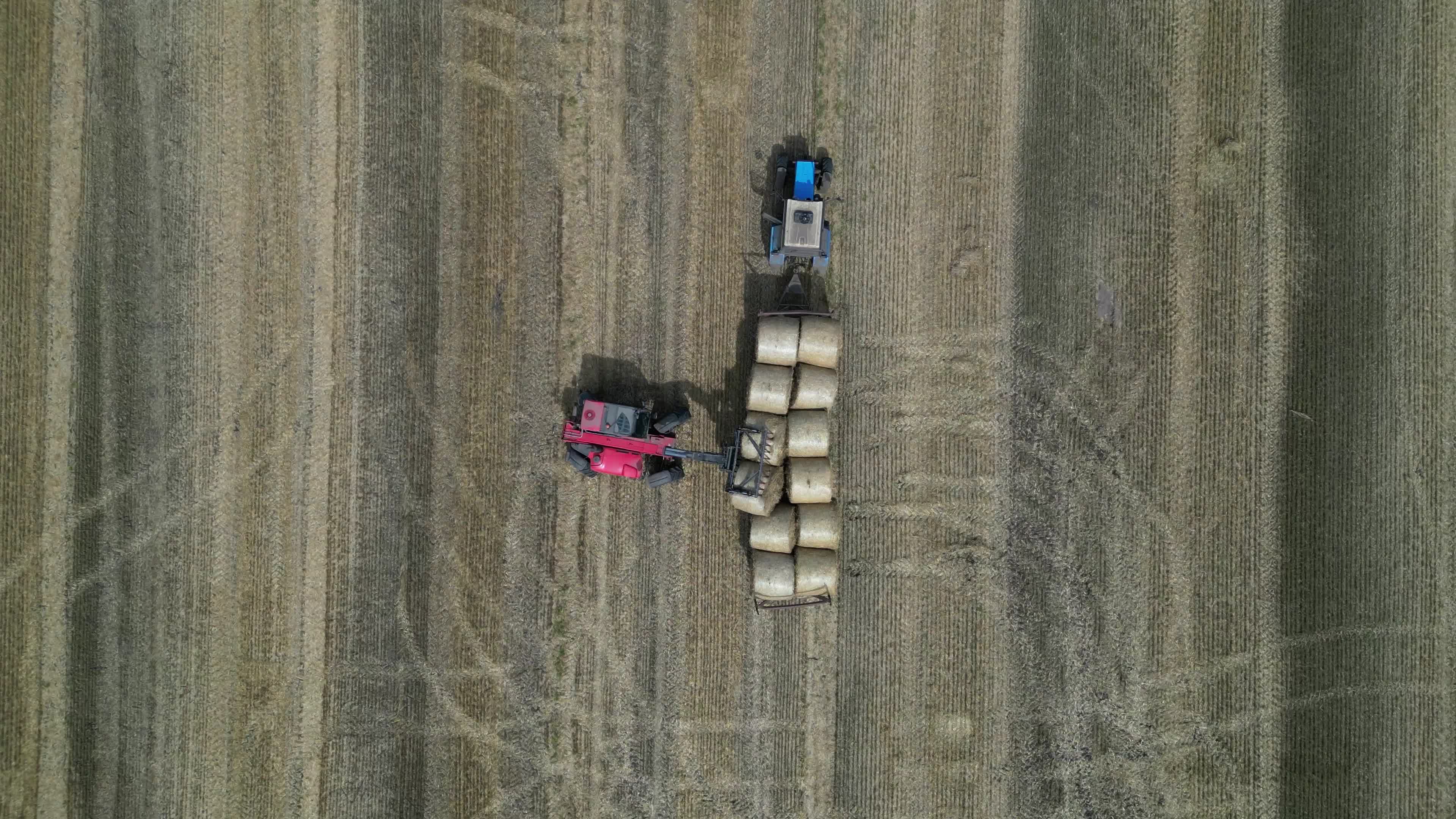 Drone view of agricultural machinery on a farm field in Kyiv region