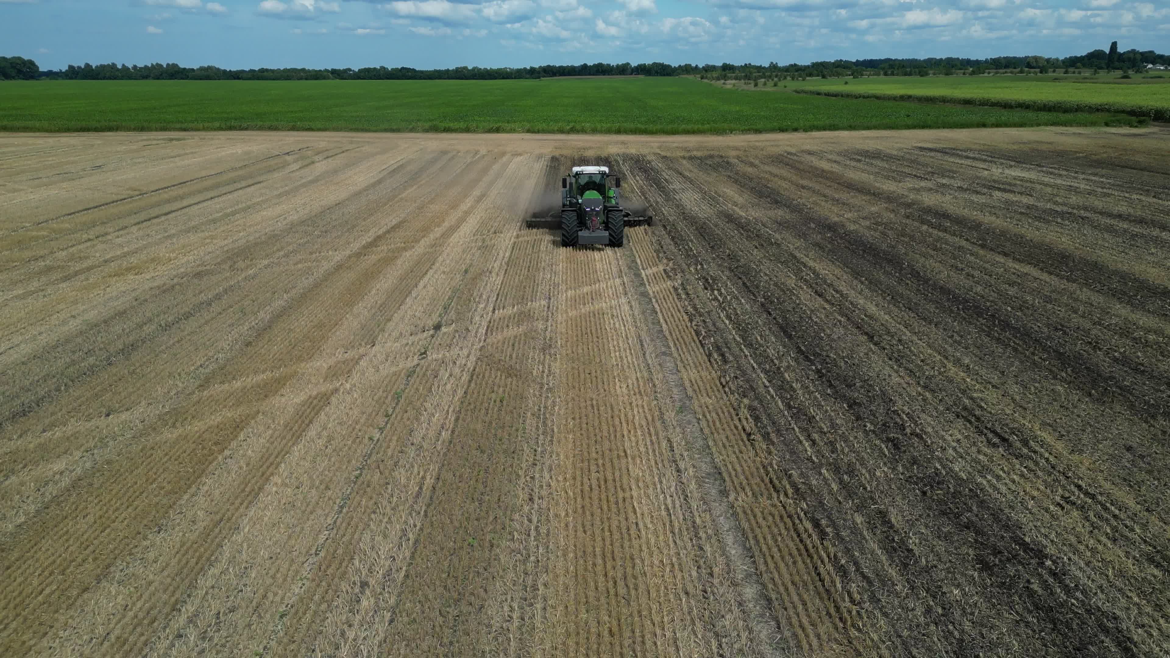 Drone view of agricultural machinery on a farm field in Kyiv region