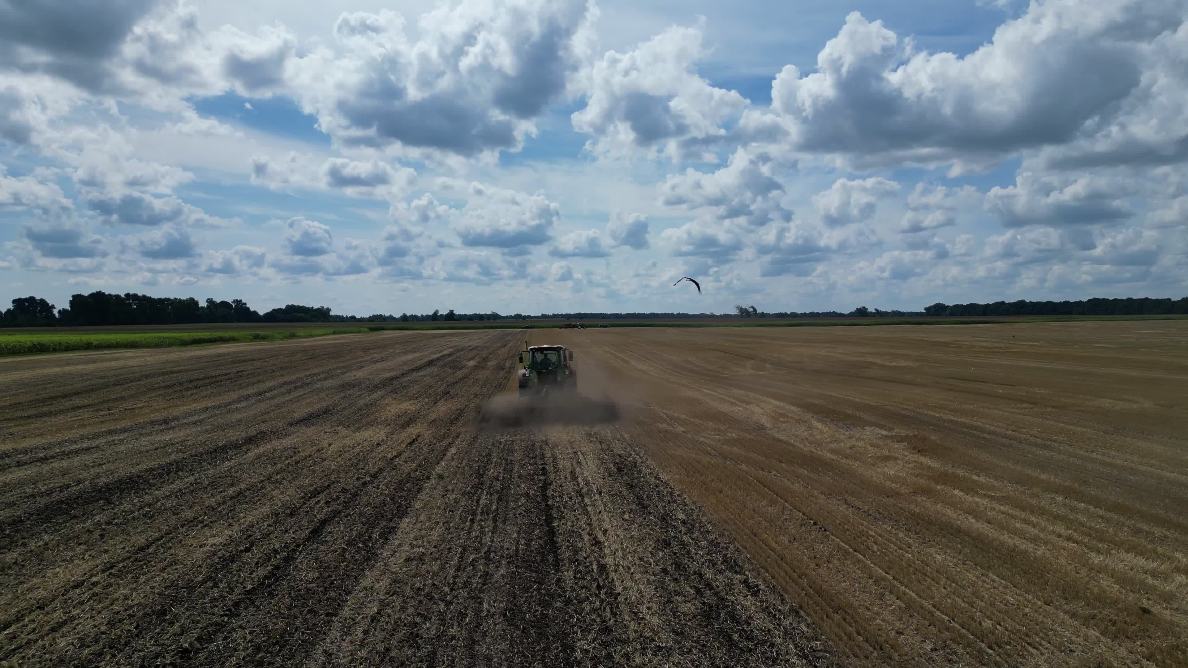 Drone view of agricultural machinery on a farm field in Kyiv region