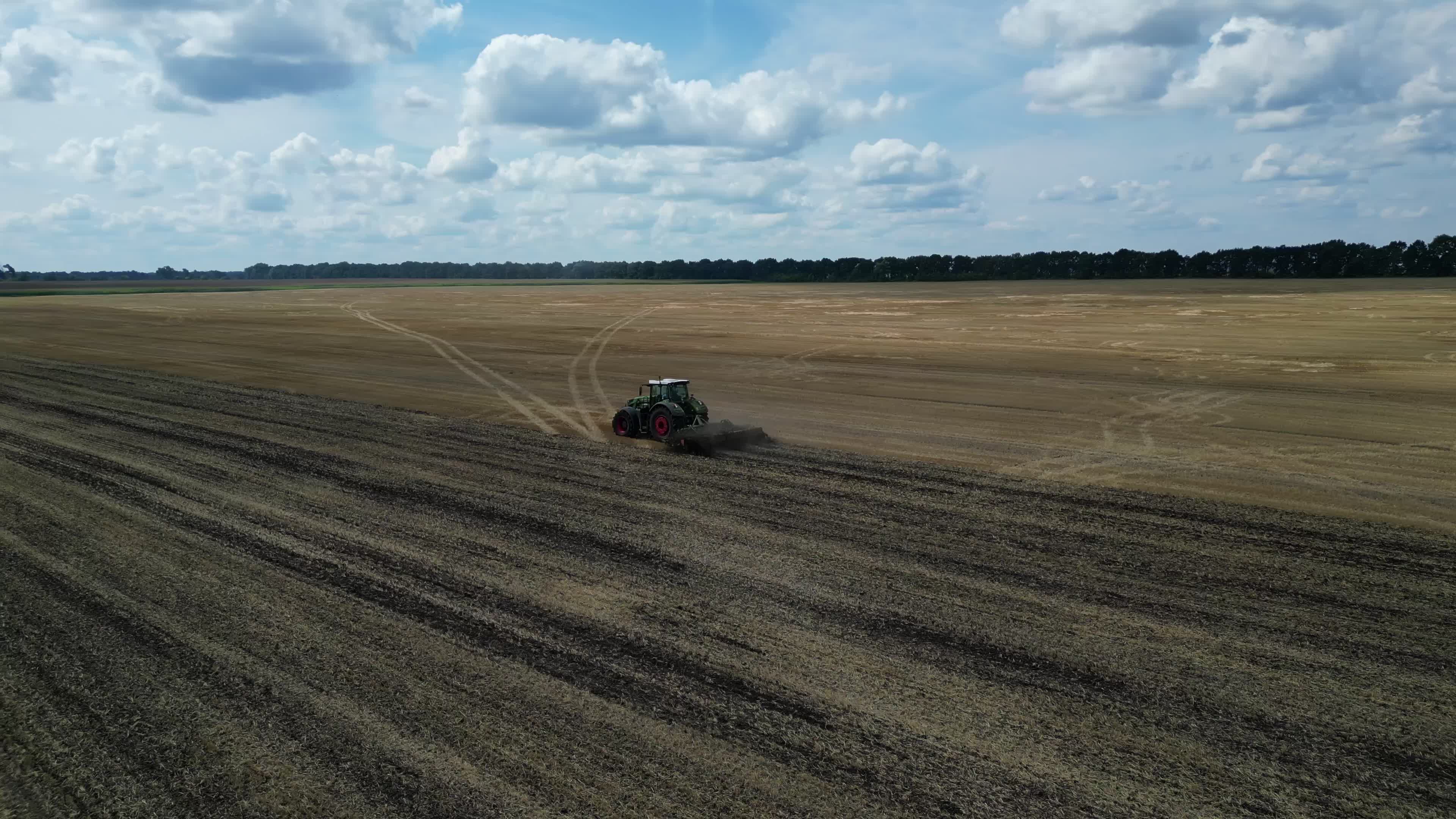 Drone view of agricultural machinery on a farm field in Kyiv region
