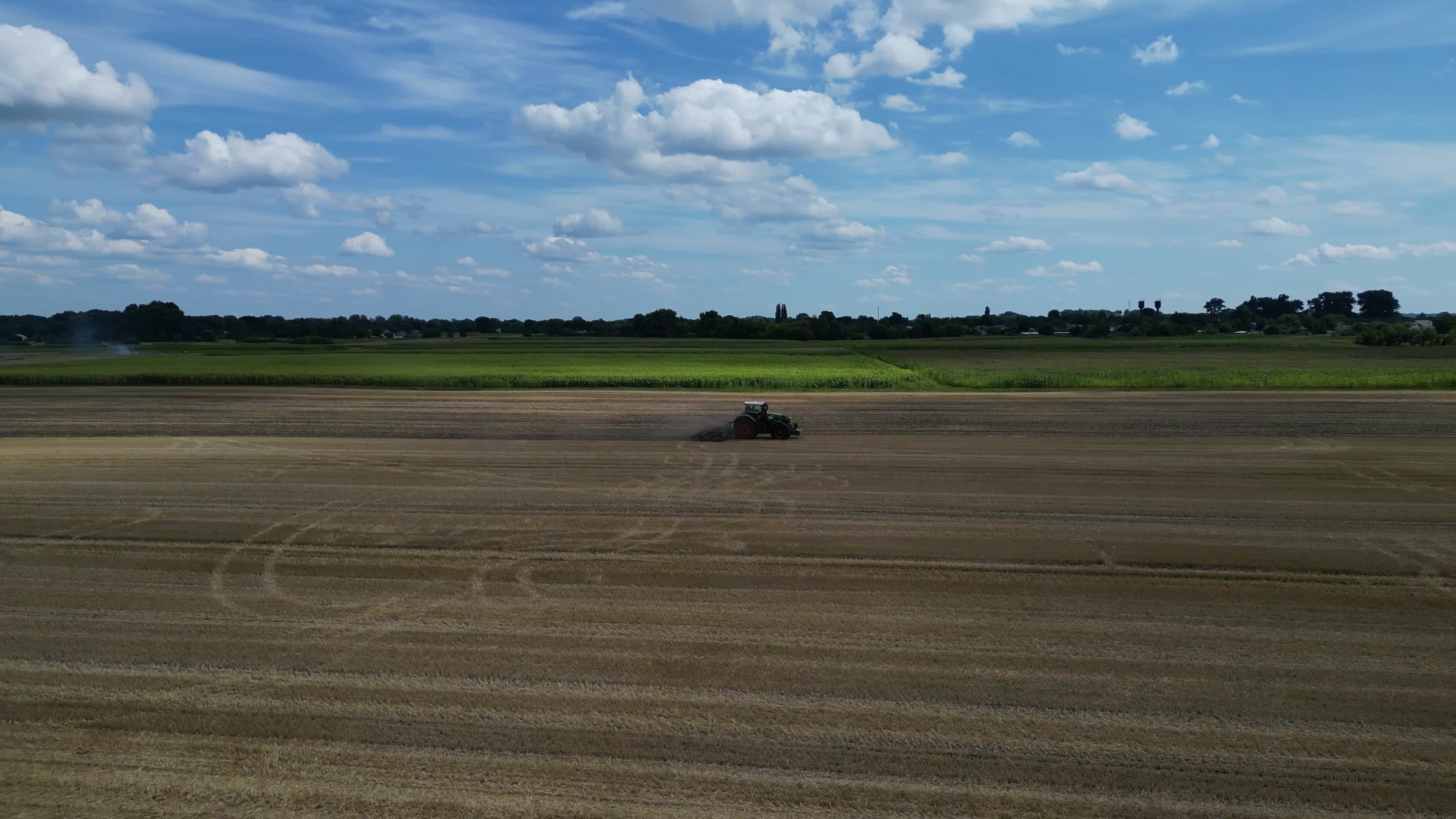 Drone view of agricultural machinery on a farm field in Kyiv region