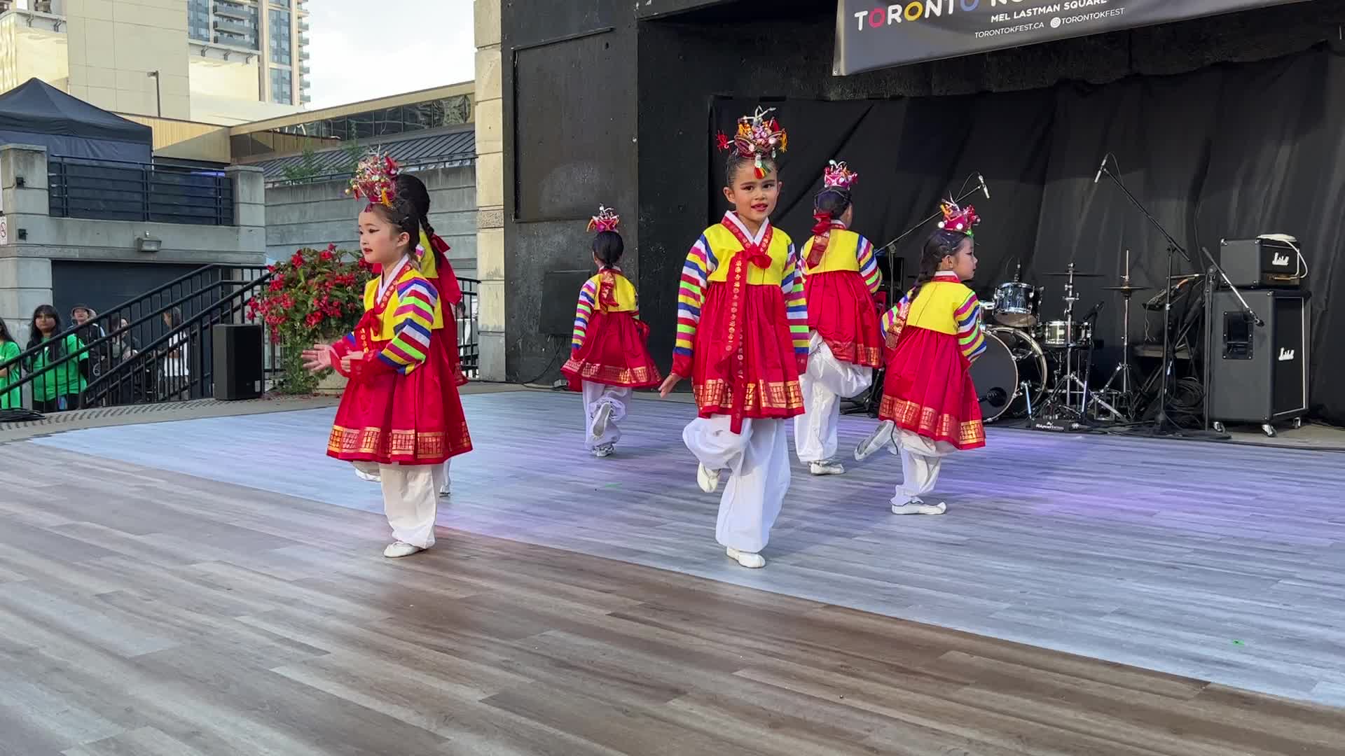 Korean children perform a puppet dance