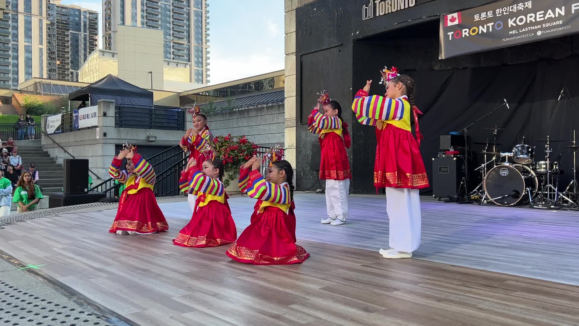 Korean children perform a puppet dance
