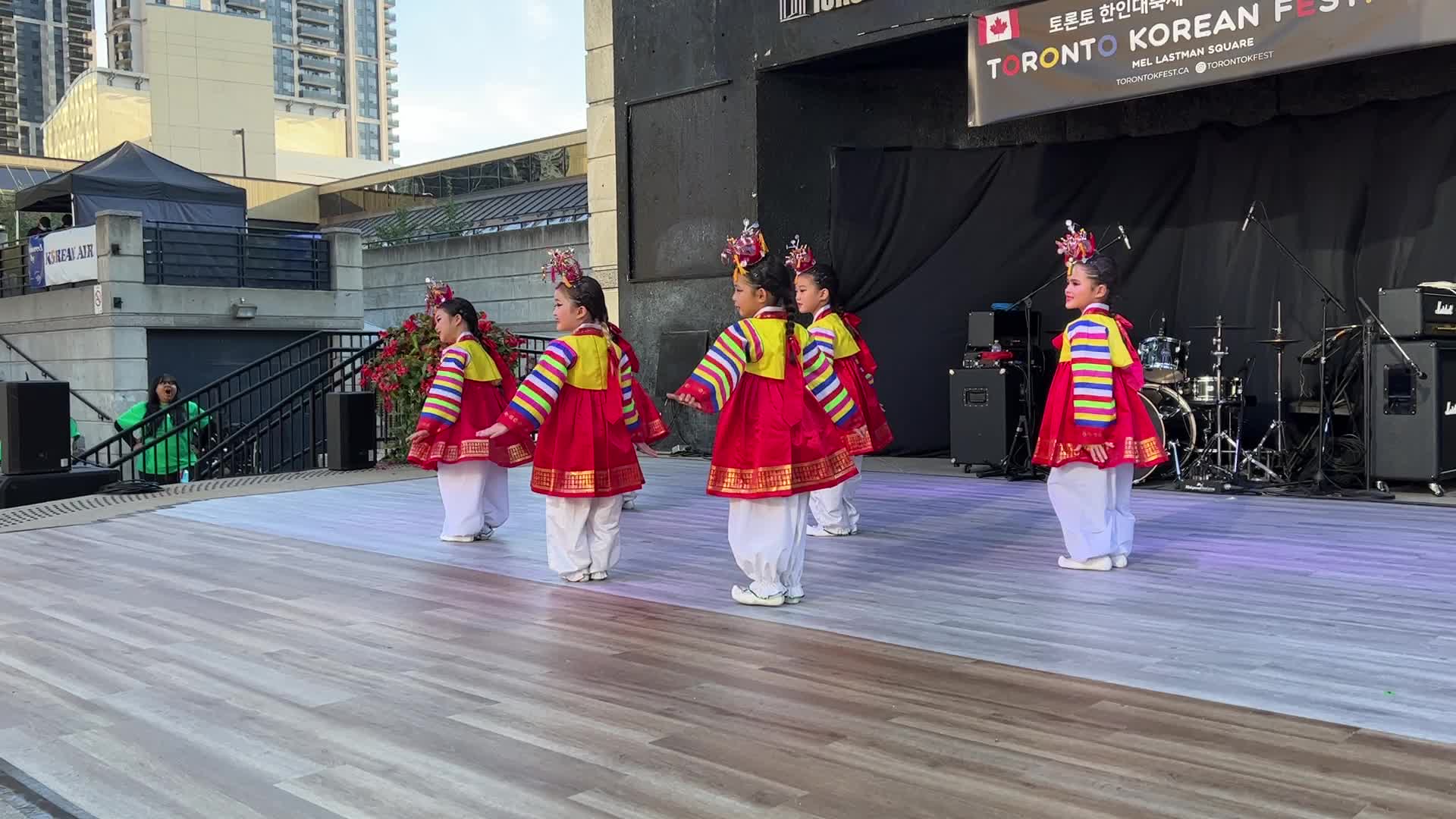Korean children perform a puppet dance