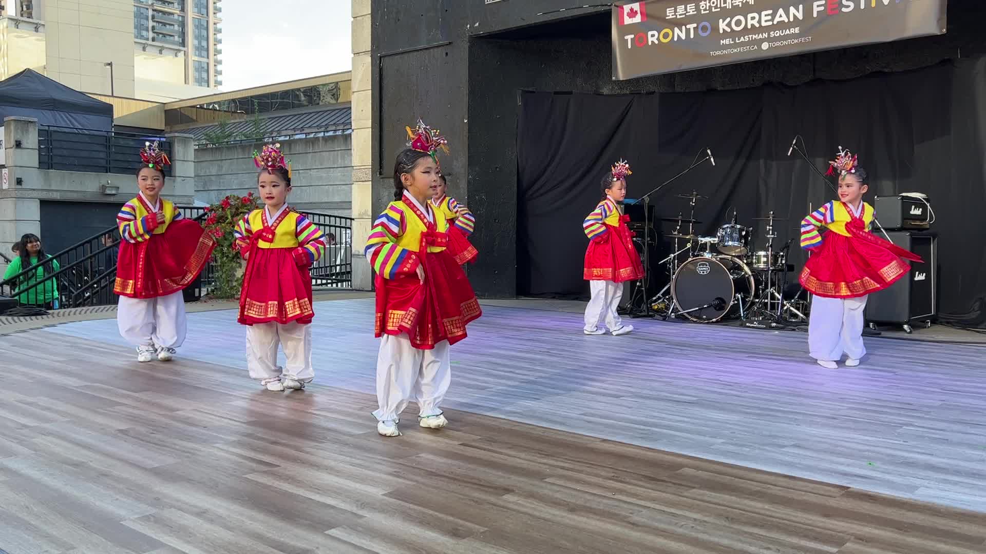 Korean children perform a puppet dance