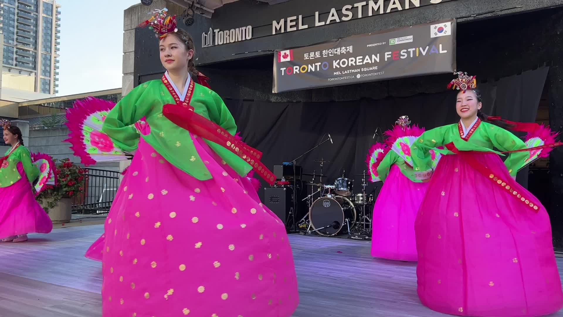 Korean girls perform a traditional Korean fan dance