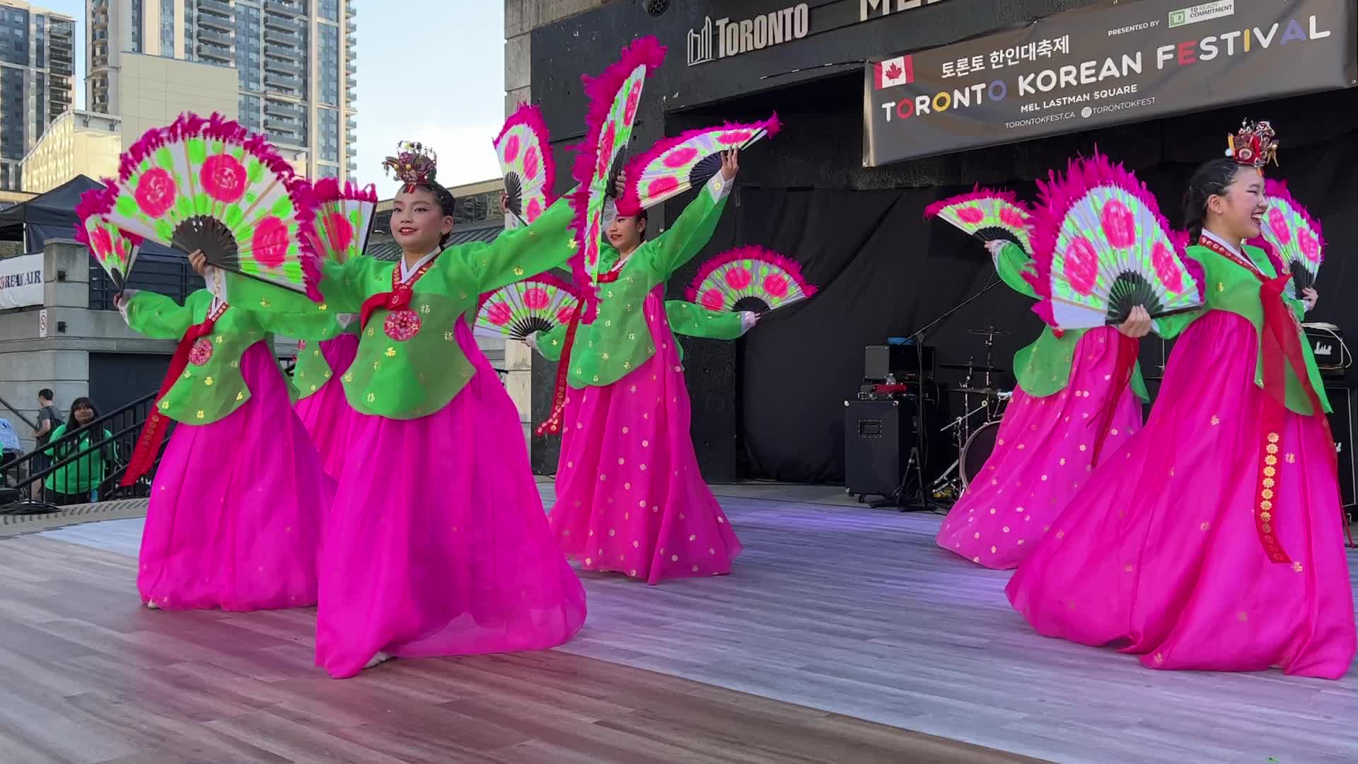 Korean girls perform a traditional Korean fan dance