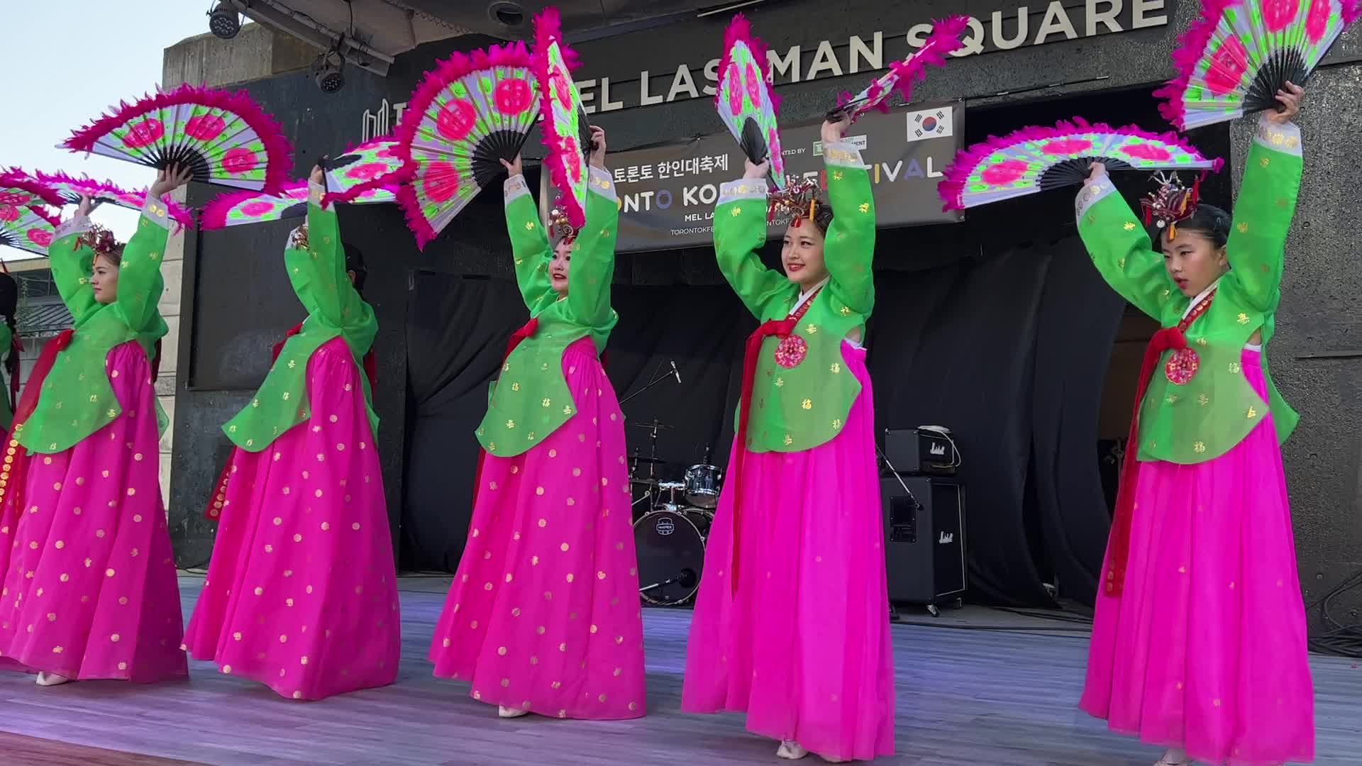 Korean girls perform a traditional Korean fan dance