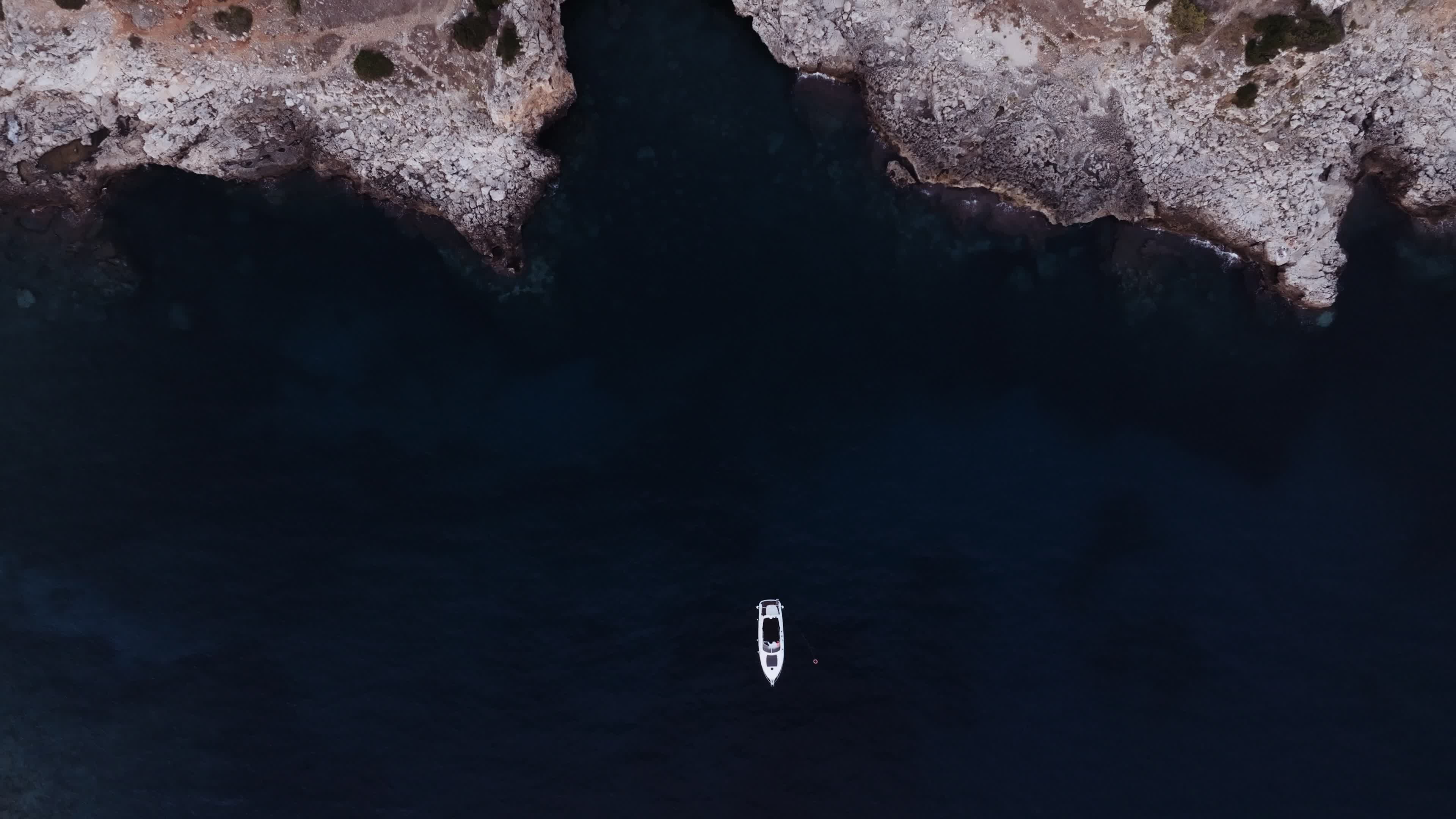 Drone View Of a Boat In Porto Selvaggio, Italy