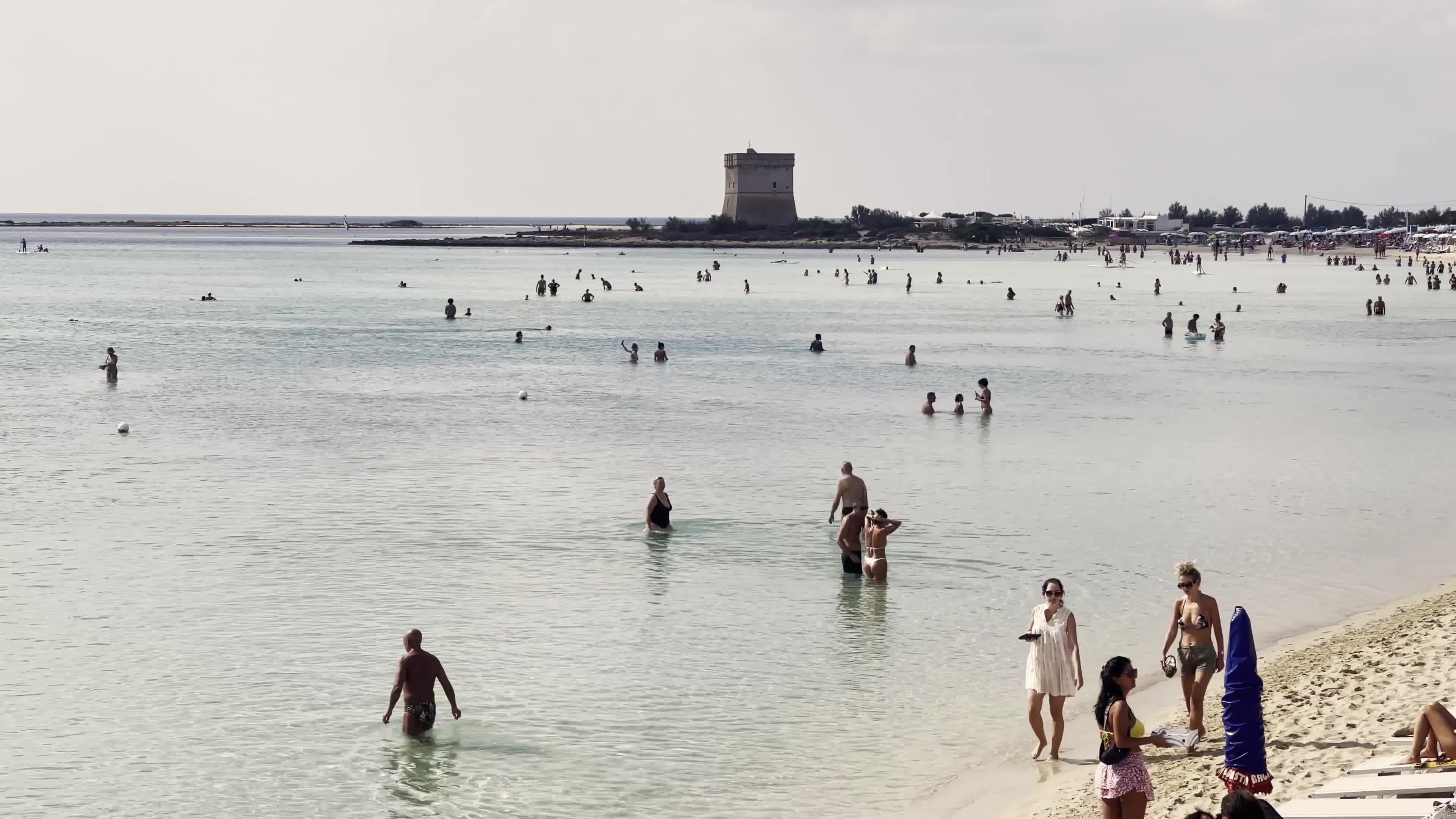People at Sea in October in Salento, Italy